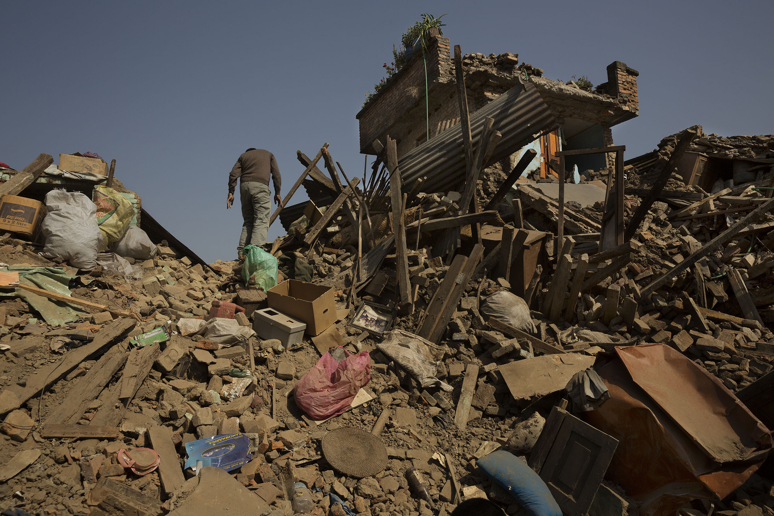 Villagers sort through rubble in Sankhu, on the outskirts of Kathmandu, May 1, 2015.