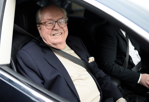France's far-right party Front National (FN) honorary president Jean-Marie Le Pen smiles as he leaves the party's headquarters in Nanterre, near Paris, on May 4, 2015.