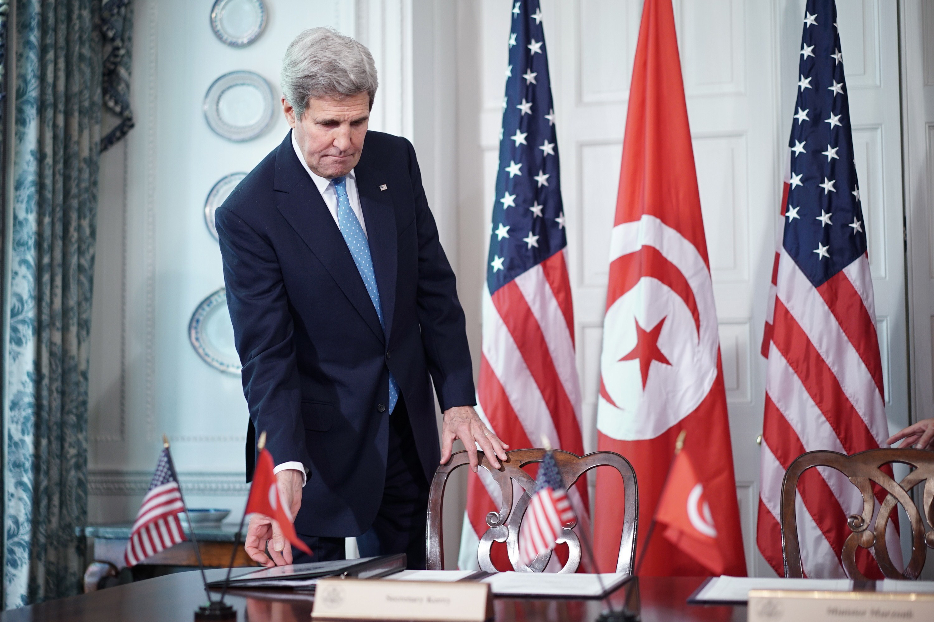US Secretary of State John Kerry arrives for a signing ceremony for a memorandum of understanding with Tunisian Minister of Political Affairs Mohsen Marzouk at Blair House, the presidential guest house, on May 20, 2015 in Washington, DC.