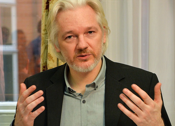 WikiLeaks founder Julian Assange gestures during a press conference inside the Ecuadorian Embassy in London on August 18, 2014.