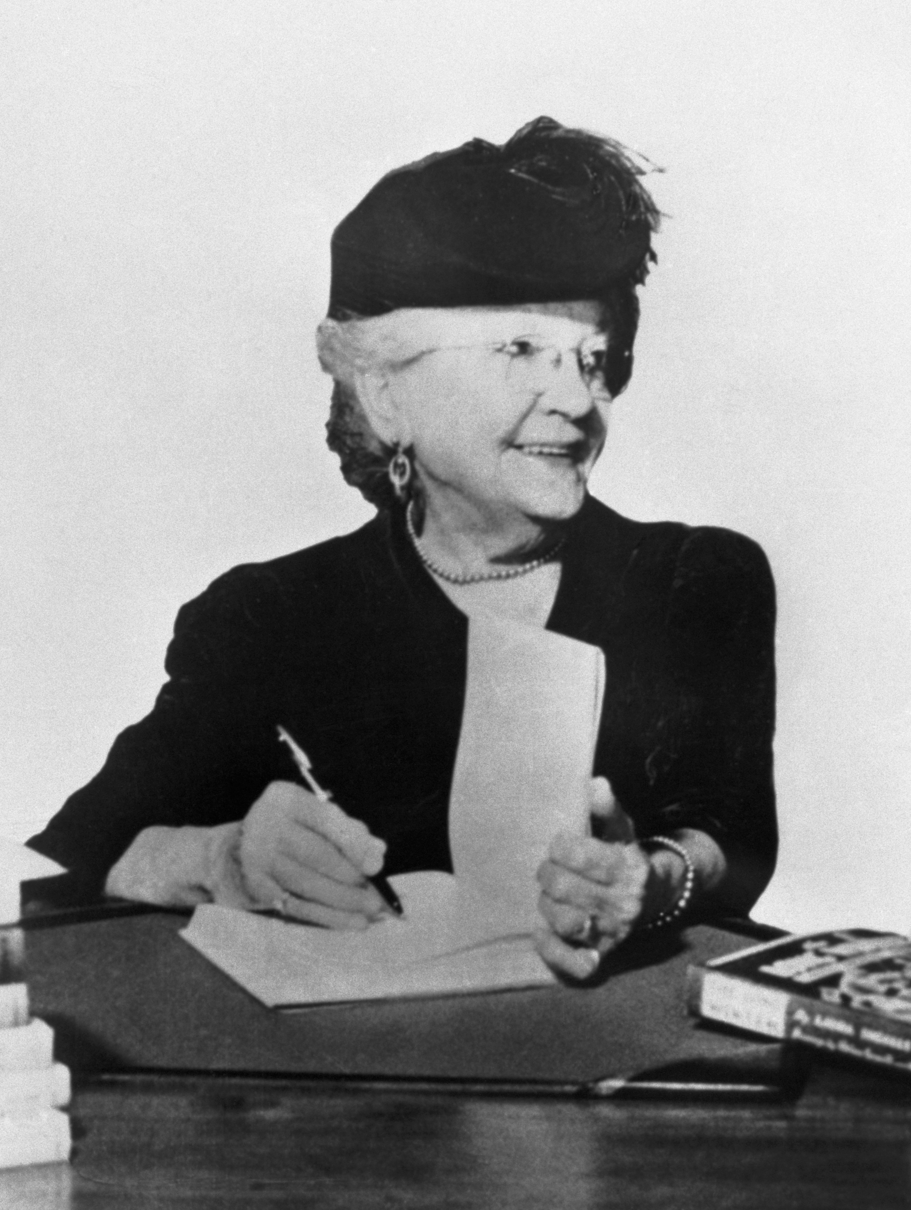 Laura Ingalls Wilder signing books ca. 1930s-1940s.