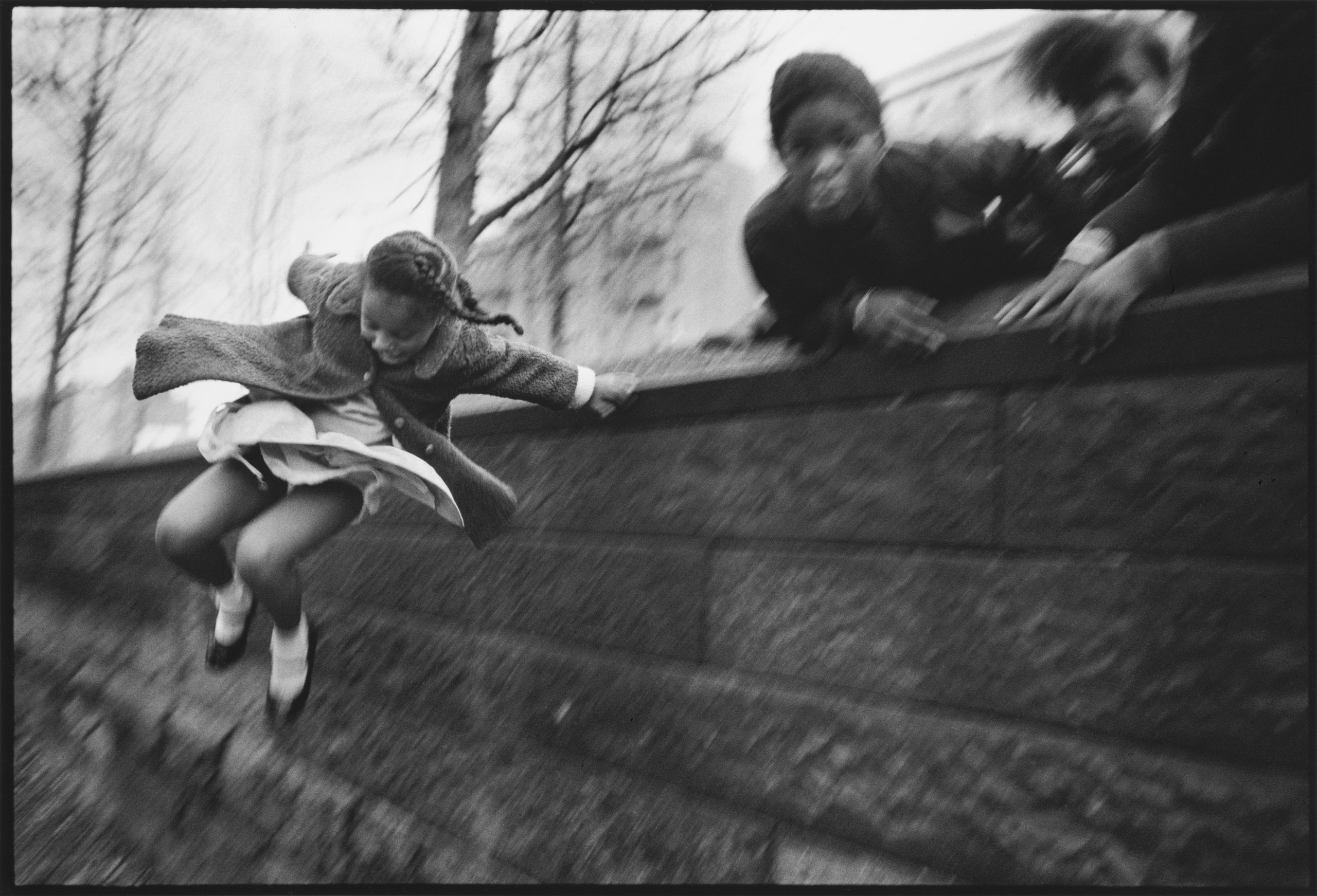 Girl jumping over a wall in Central Park. New York, 1967. (Mary Ellen Mark)