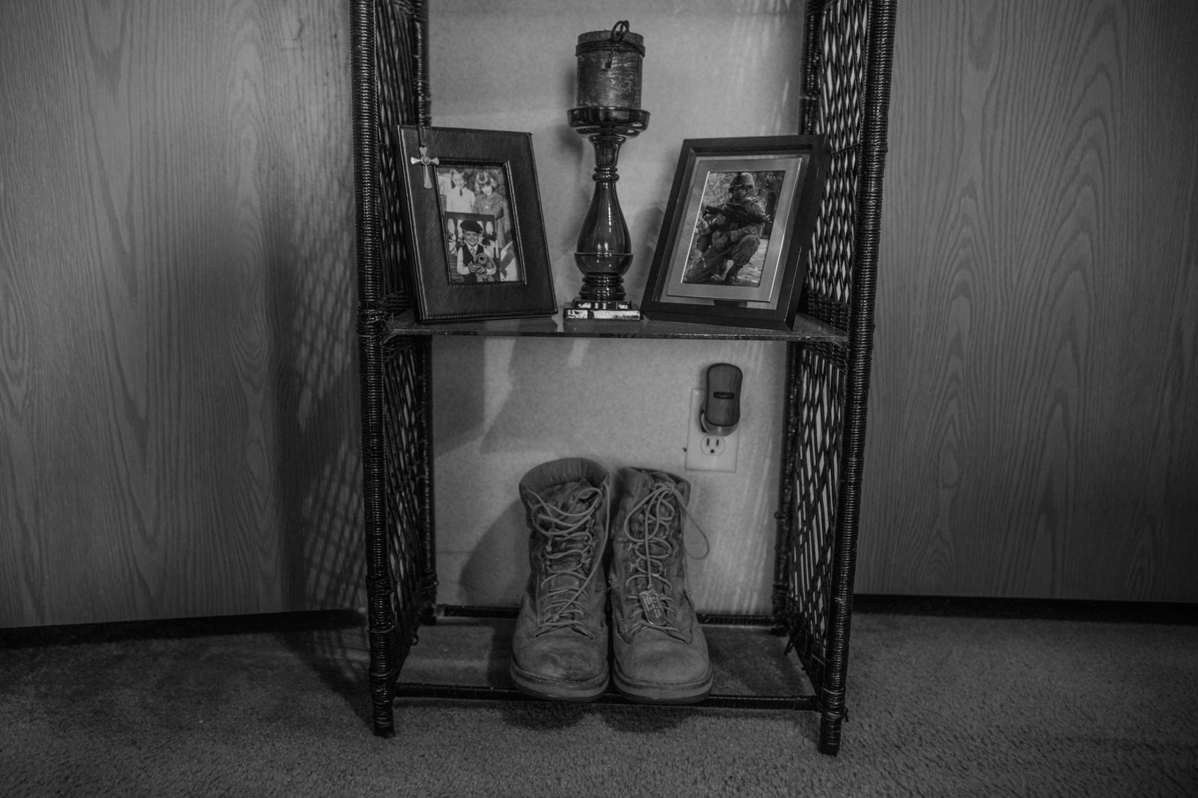 Brandon Ladner. Pelham, Alabama.Brandon Ladner's Marine Corps boots sit on a small shelf in his bedroom. Brandon was a U.S. Marine Corps Veteran. He fought in Afghanistan's Helmand Province.Brandon, suffering from PTSD shot himself inside his living room. The bullet remains lodged in the ceiling of the home where his mother Renee now lives.