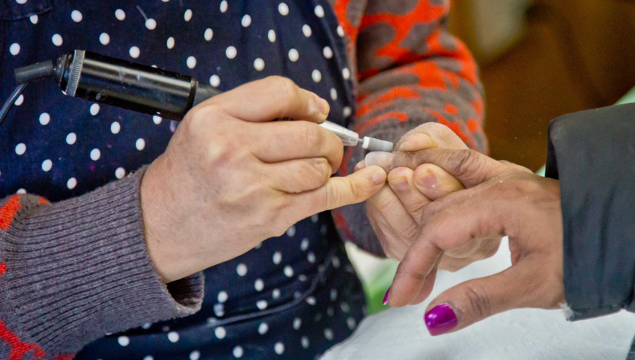 A customer receives a manicure at Castle nail salon in New York City on Jan. 8, 2015.