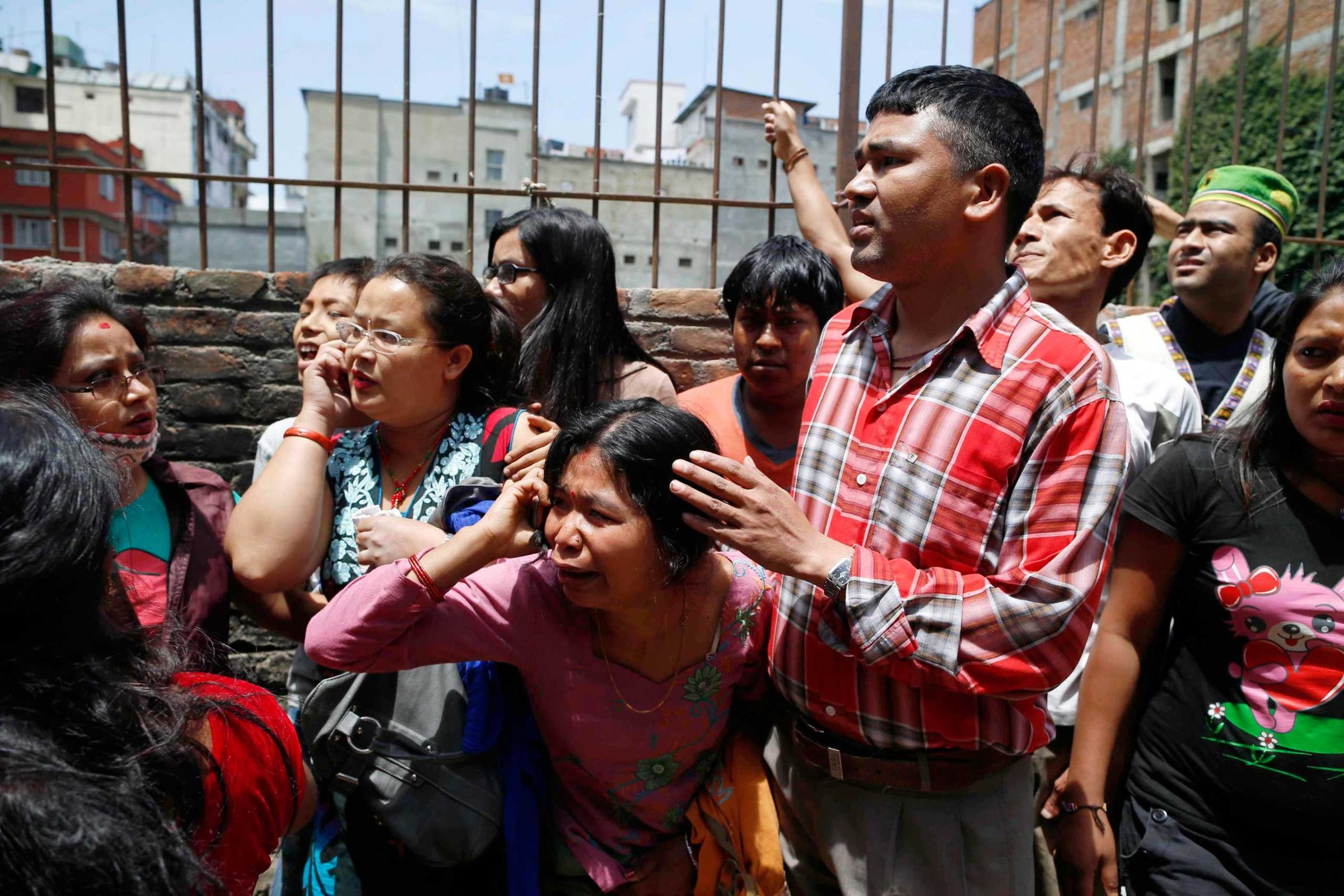 Nepalese run for open space as a strong earthquake hits Kathmandu on May 12, 2015.