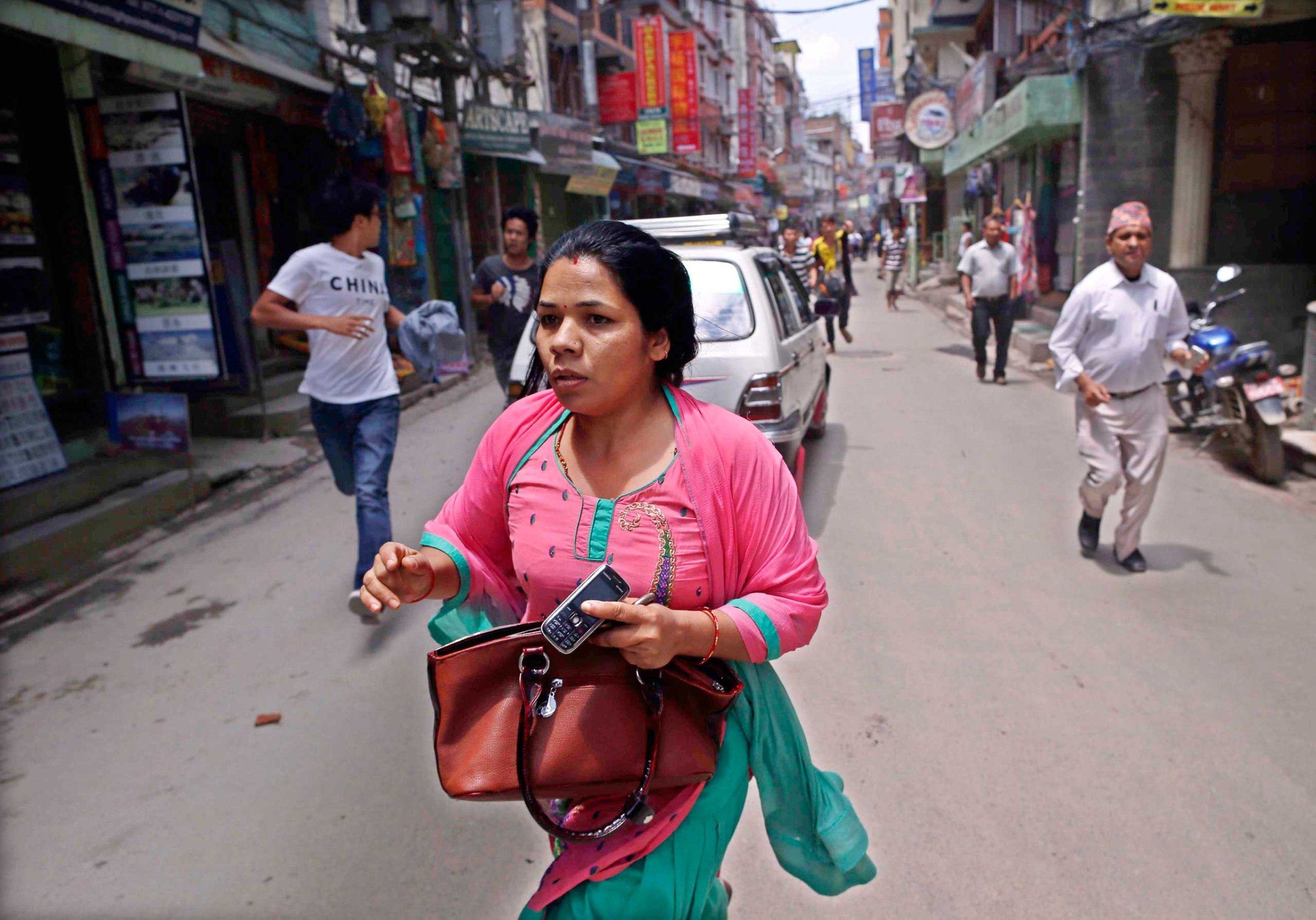Nepalese search for open space as a strong earthquake hits Kathmandu on May 12, 2015.