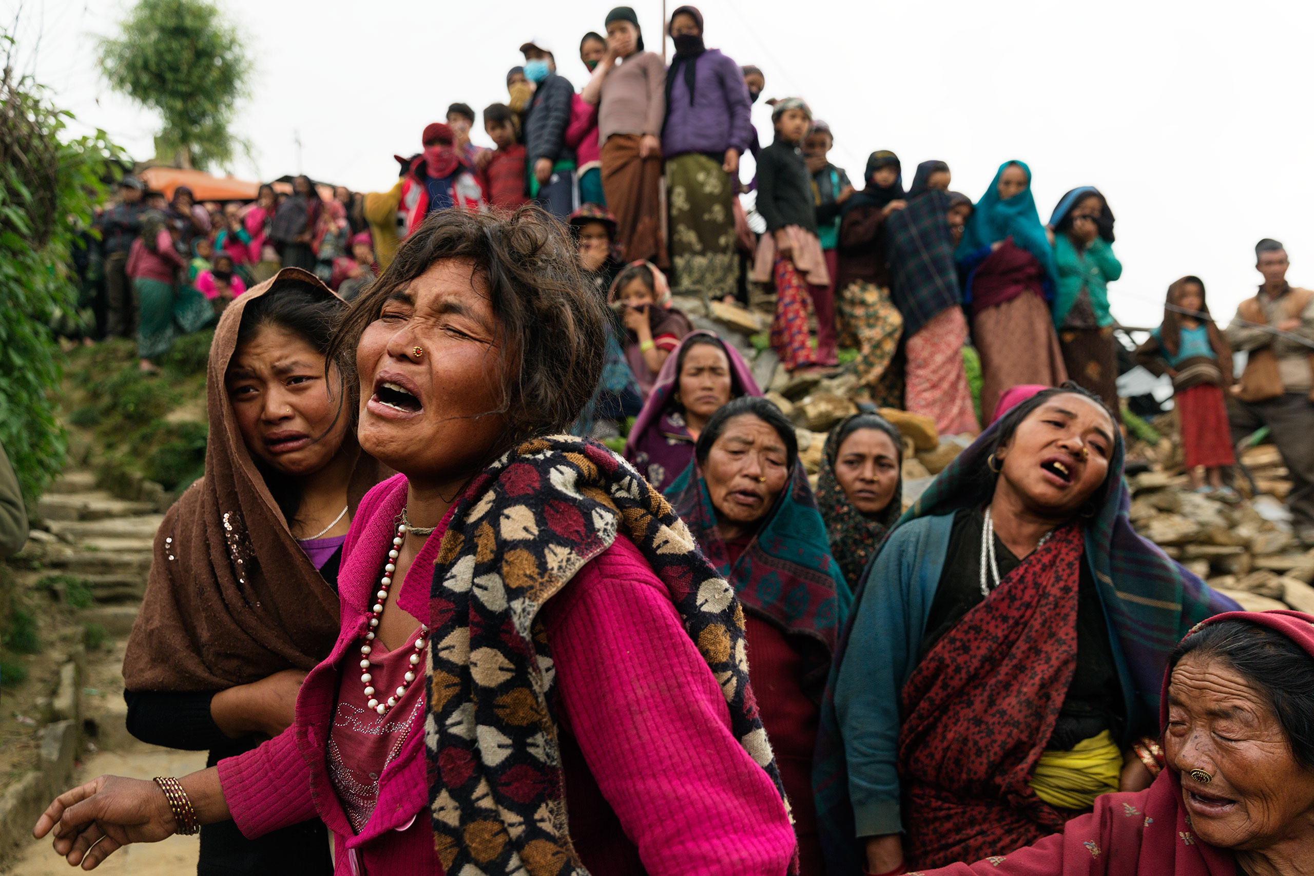 Bishnu Gurung sobs after her 3-year-old daughter, Rejina Gurung, was found buried in the rubble in  the village of Gumda in Gorkha district, near the epicenter of last month's Nepal earthquake, on May 8, 2015. The baby’s father is a guest worker in Malaysia.