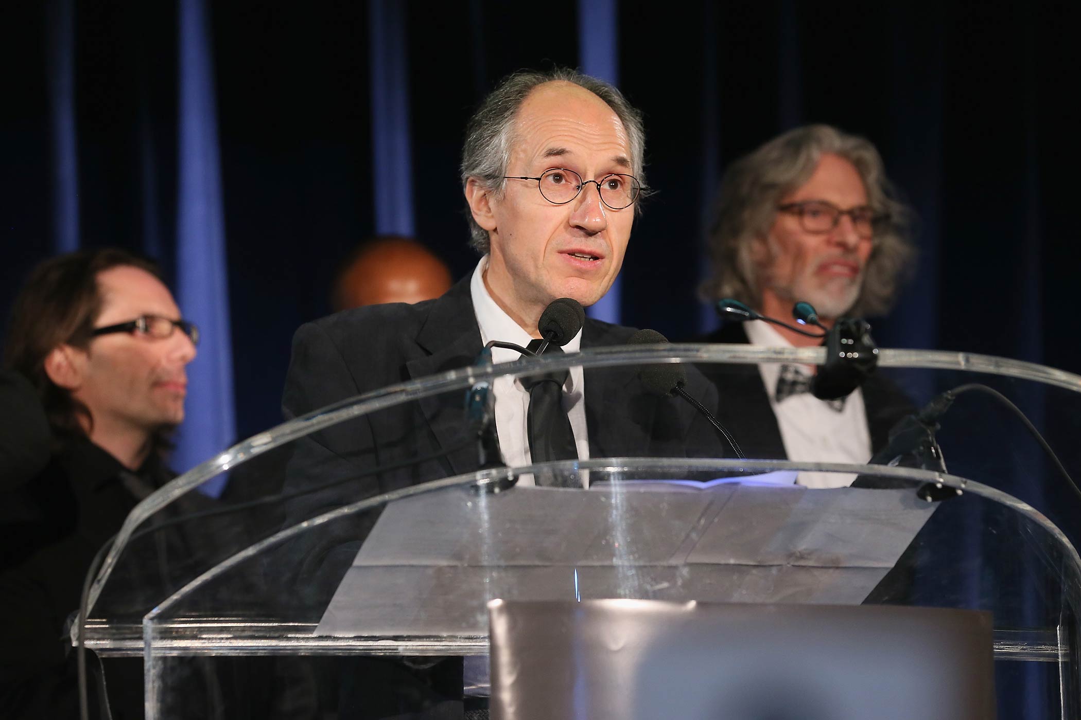 Charlie Hebdo editor-in-chief Gerard Biard accepts the PEN/Toni and James C. Goodale Freedom of Expression Courage Award onstage with Charlie Hebdo Film Critic Jean-Baptiste Thoret, left, and New York Cartoon Editor Bob Mankoff, right, at the PEN American Center Literary Gala at the American Museum of Natural History on May 5, 2015 in New York. (Jemal Countess—Getty Images)