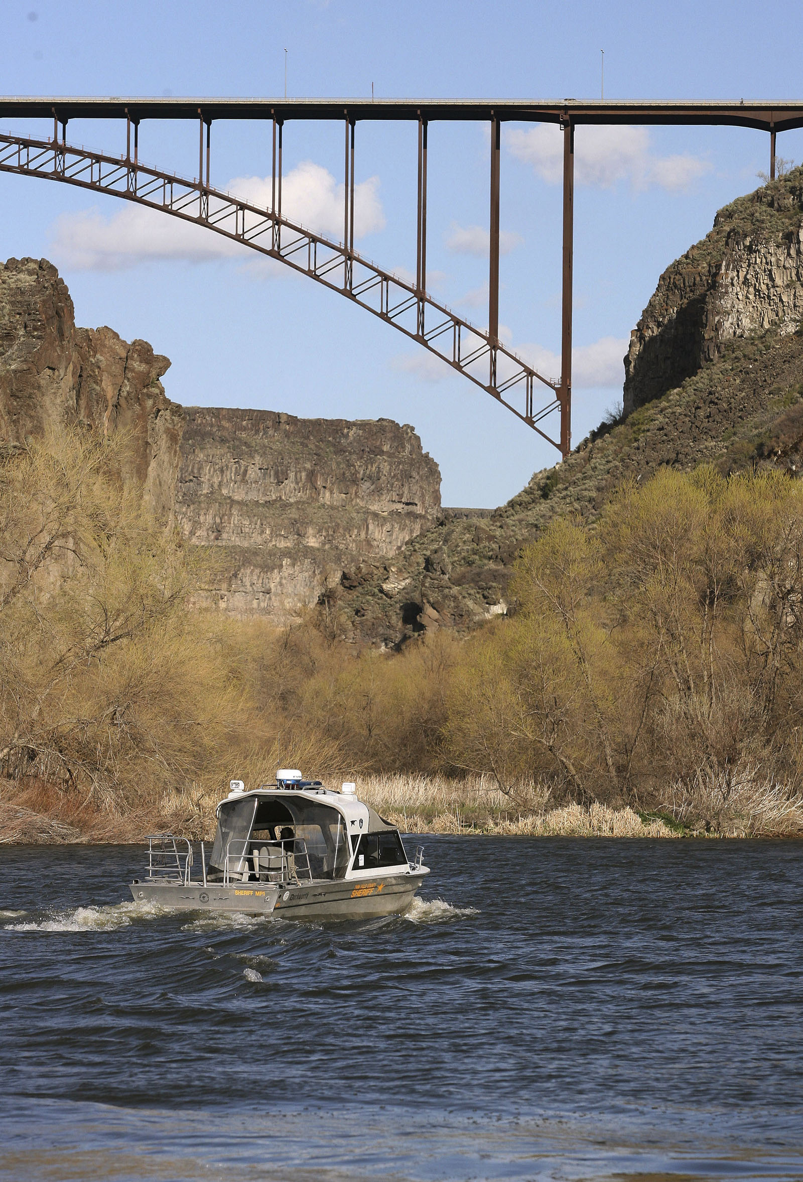 A Twin Falls County Sheriff Department Search and Rescue boat heads up the Snake River on April 10, 2007, in Twin Falls, Idaho.
