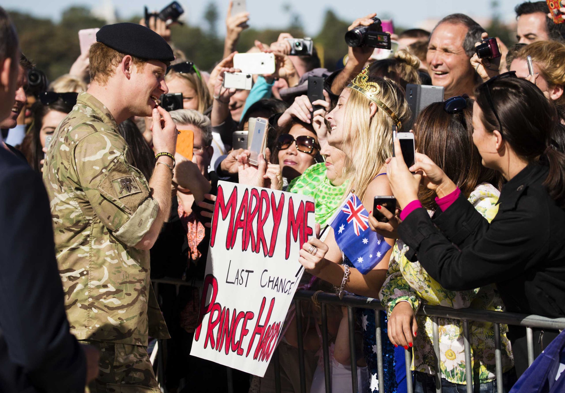 Prince Harry considers a marriage proposal from Victoria McRae from Dee Why as he is farewelled by hundreds of fans at the Sydney Opera House in Sydney on May 7, 2015.