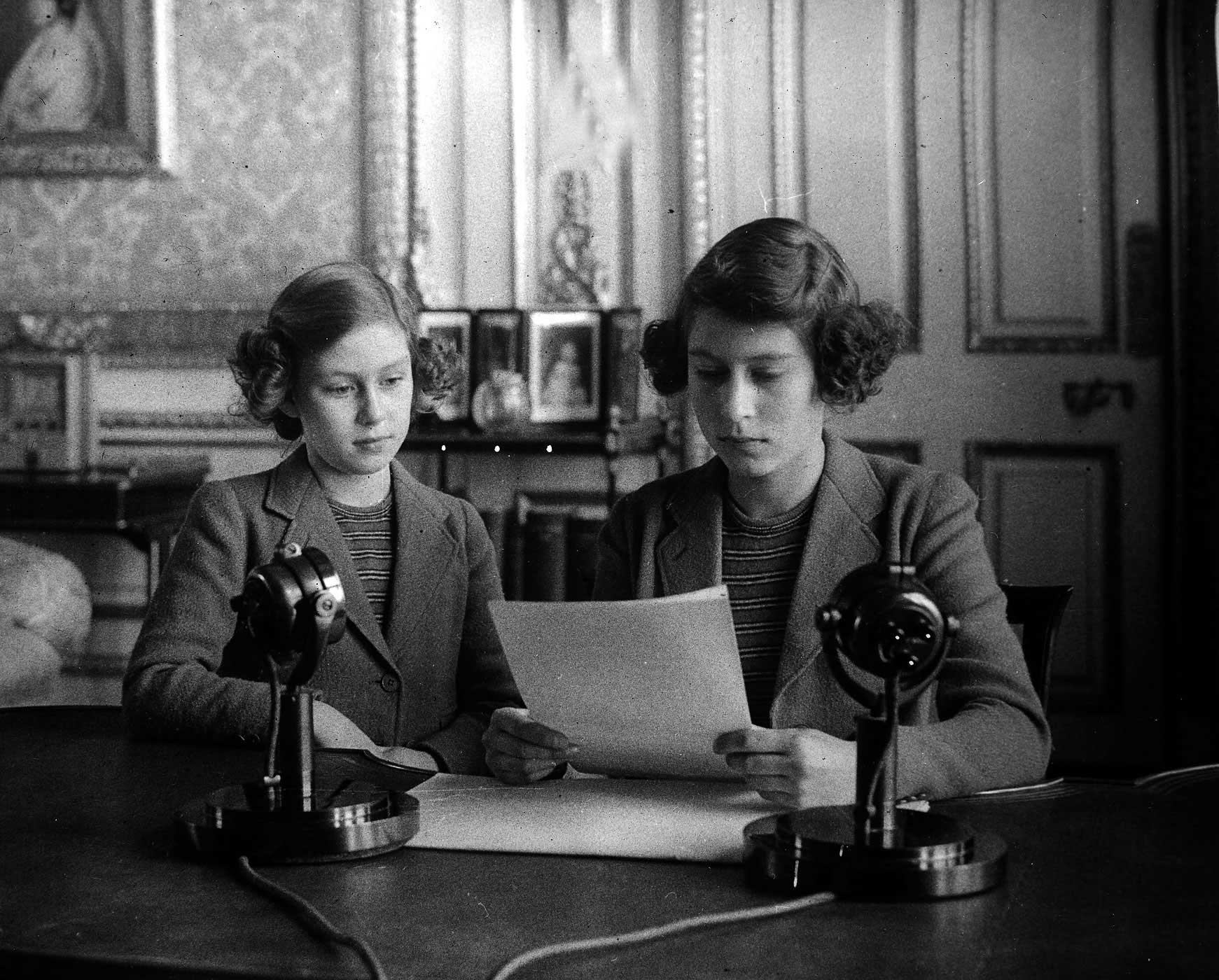 British Royalty, 1940, Princess Elizabeth (later Queen Elizabeth II), right, broadcasting with her sister Princess Margaret alongside