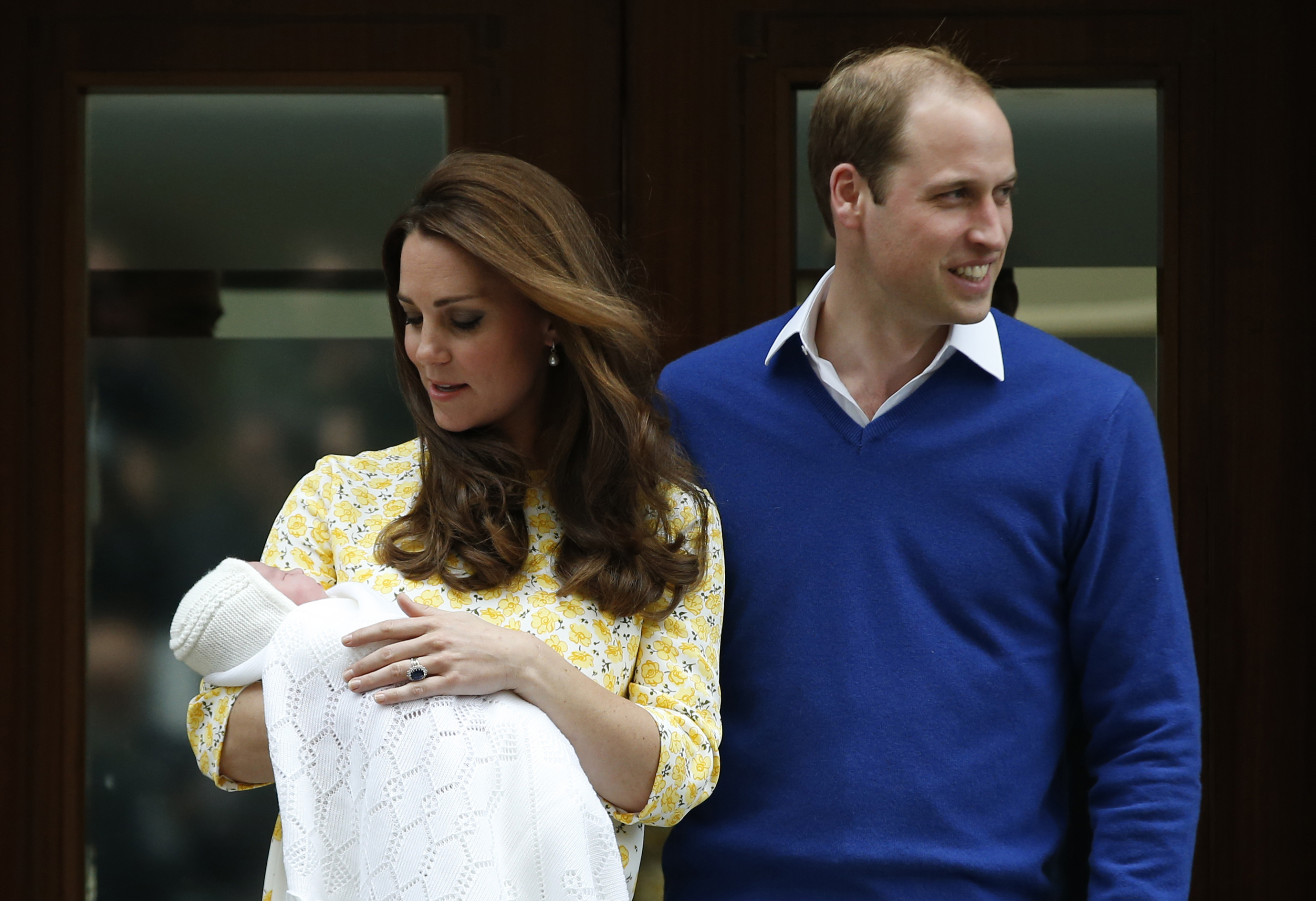 Britain's Prince William, right, and Kate, Duchess of Cambridge, pose for the media with their newborn daughter outside St. Mary's Hospital's exclusive Lindo Wing, London, on May 2, 2015. (Alastair Grant—AP)