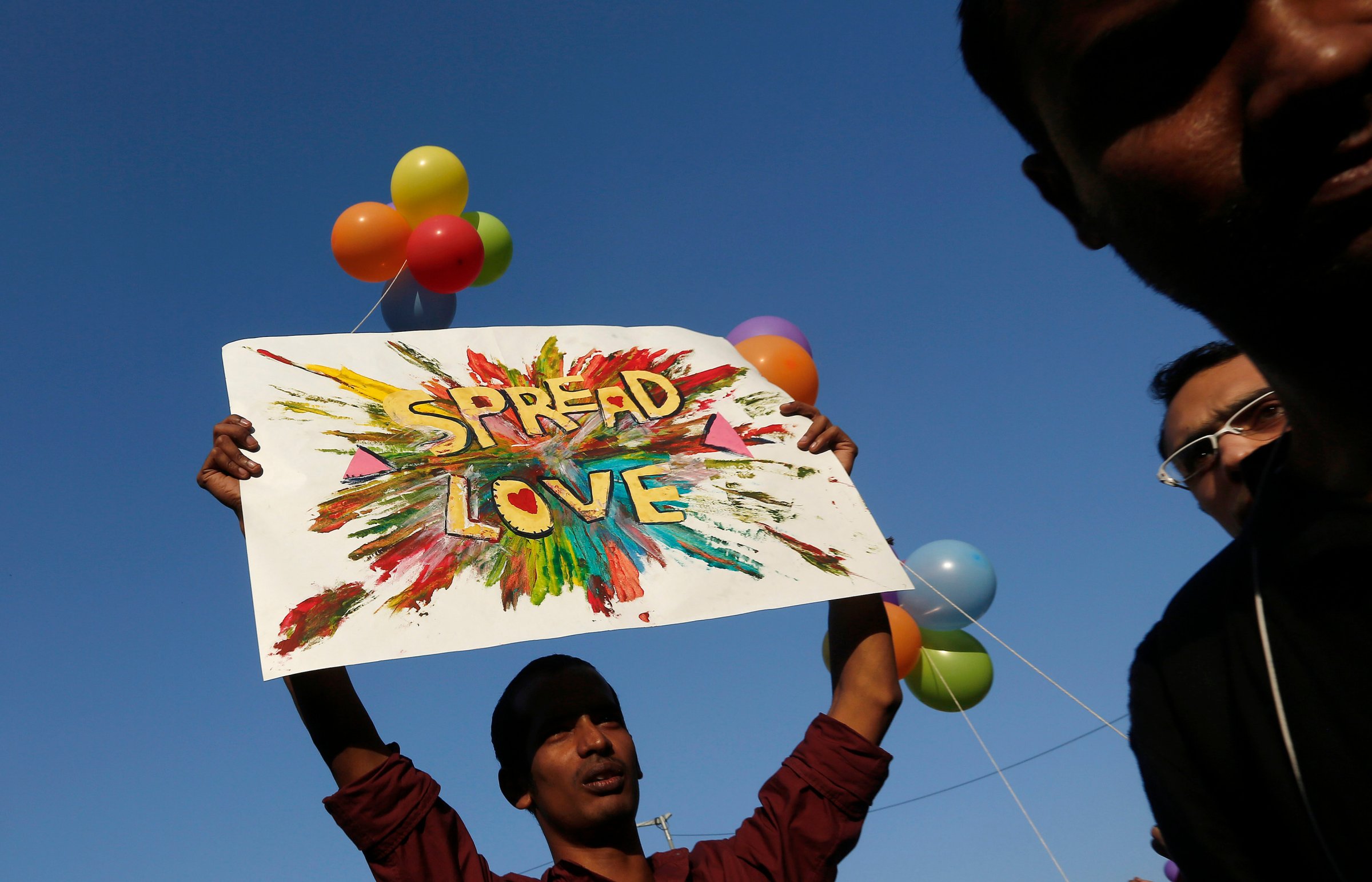A participant holds a placard during Delhi Queer Pride Parade in New Delhi