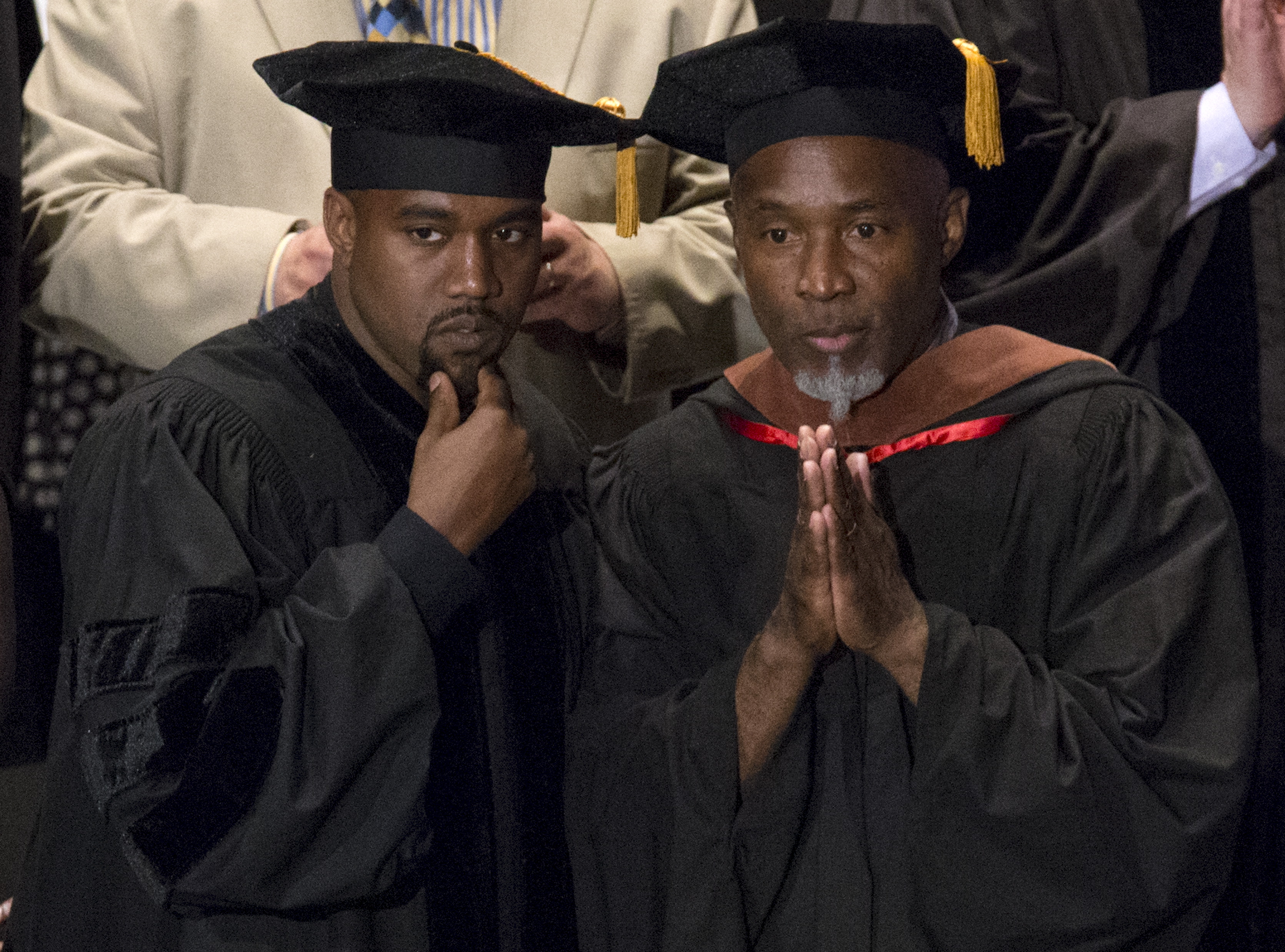 Musician Kanye West and School of the Art Institute of Chicago Professor Nick Cave attend the school's annual commencement ceremony where West received an honorary doctorate degree in Chicago, Illinois on May 11, 2015