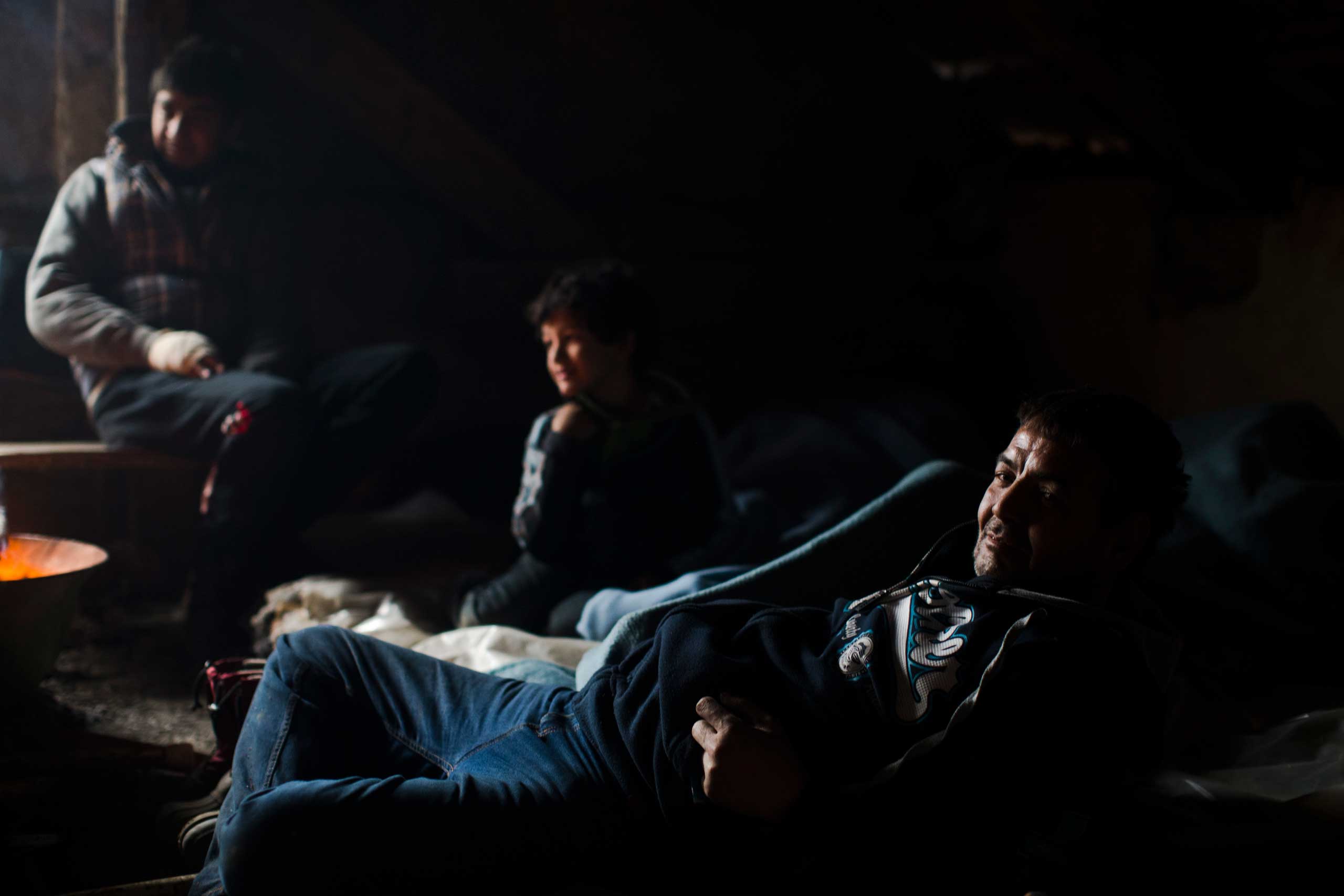 Migrants from Afghanistan rest at an abandoned house on the outskirts of Subotica, 90 miles north of Belgrade, Serbia on Feb. 26, 2015,
