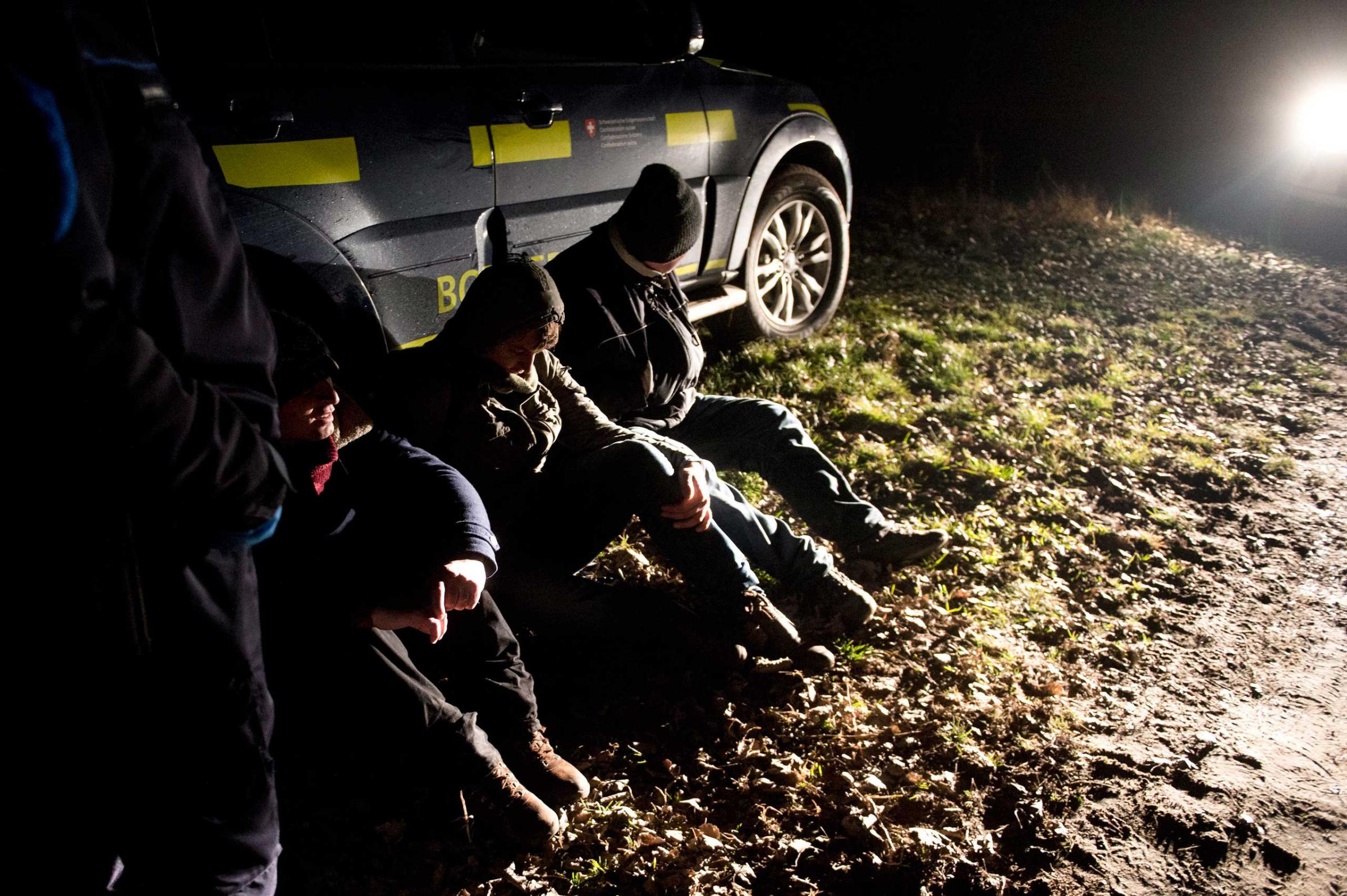 Migrants are detained by a Hungarian civil guard after being caught on the Hungarian-Serbian border near Roszke, south of Szeged, 100 miles south of Budapest, Hungary on Jan. 19, 2015.