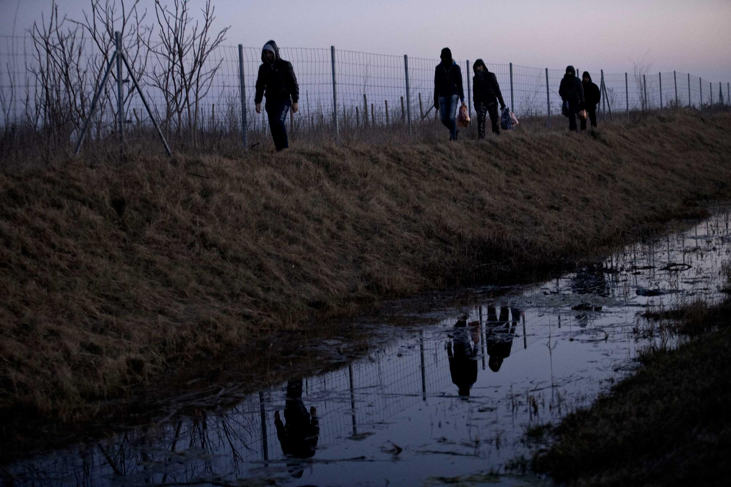 Afghan migrants trek their way to the Serbian border with Hungary close to Hajdukovo, 90 miles north of Belgrade, Serbia on Feb. 17, 2015,