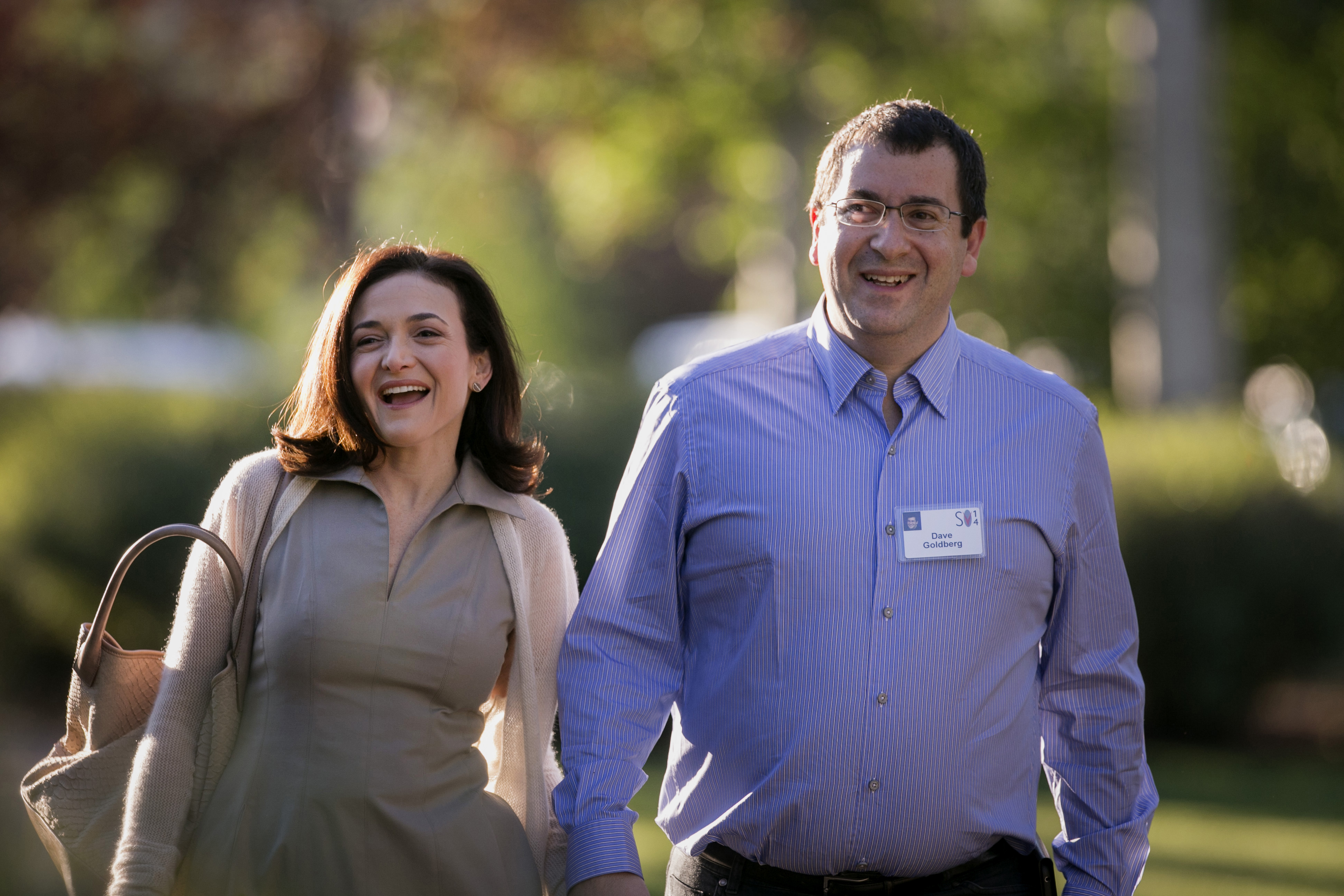 Sheryl Sandberg, chief operating officer of Facebook Inc., left, and her late husband David Goldberg, chief executive officer of SurveyMonkey, arrive to a morning session at the Sun Valley Lodge during the Allen & Co. Media and Technology Conference in Sun Valley, Idaho, on July 9, 2014. (Scott Eells—Bloomberg/Getty Images)