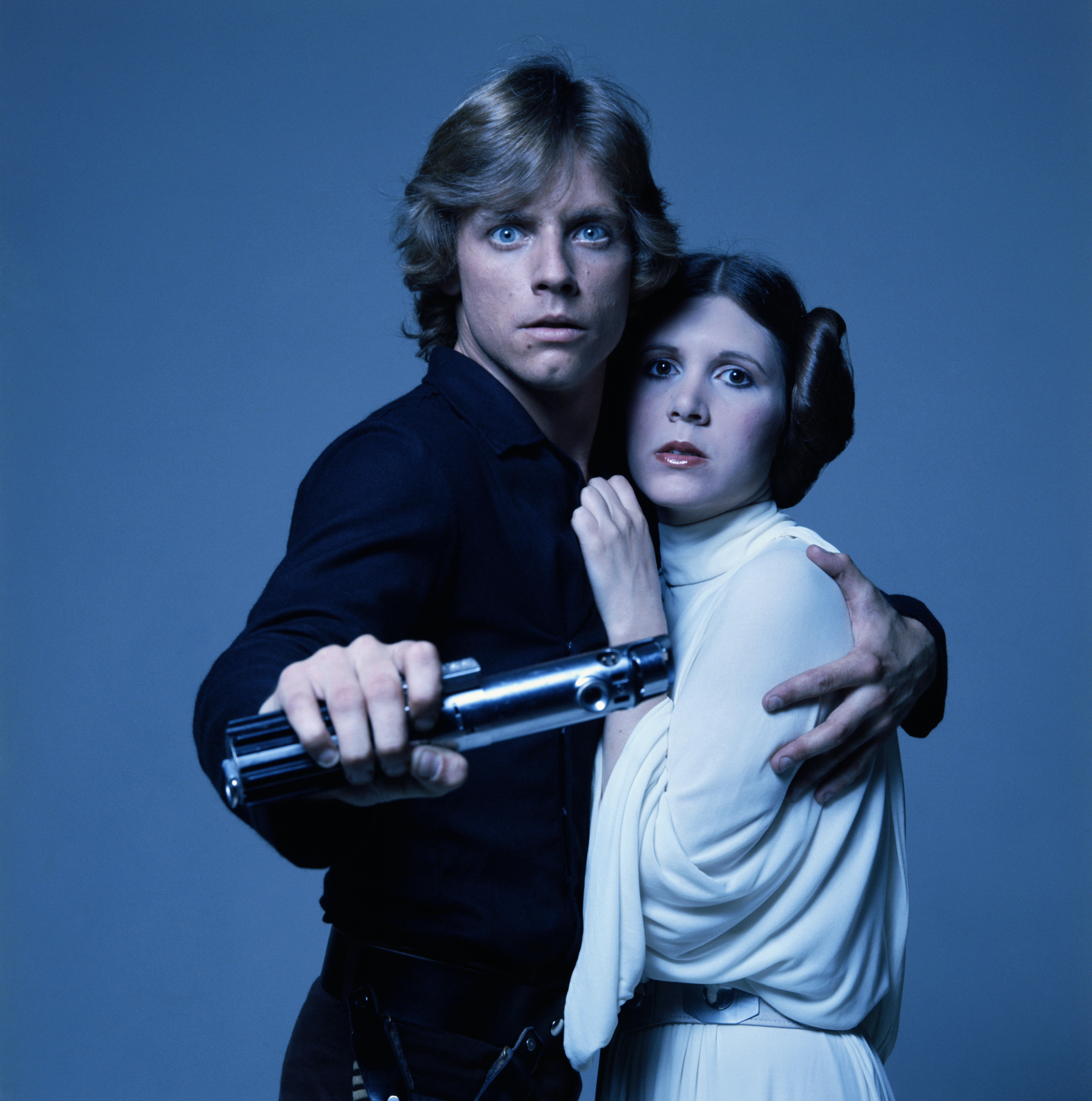 American actors Mark Hamill and Carrie Fisher in costume as brother and sister Luke Skywalker and Princess Leia in George Lucas' Star Wars trilogy, 1977. (Terry O'Neill—Getty Images)