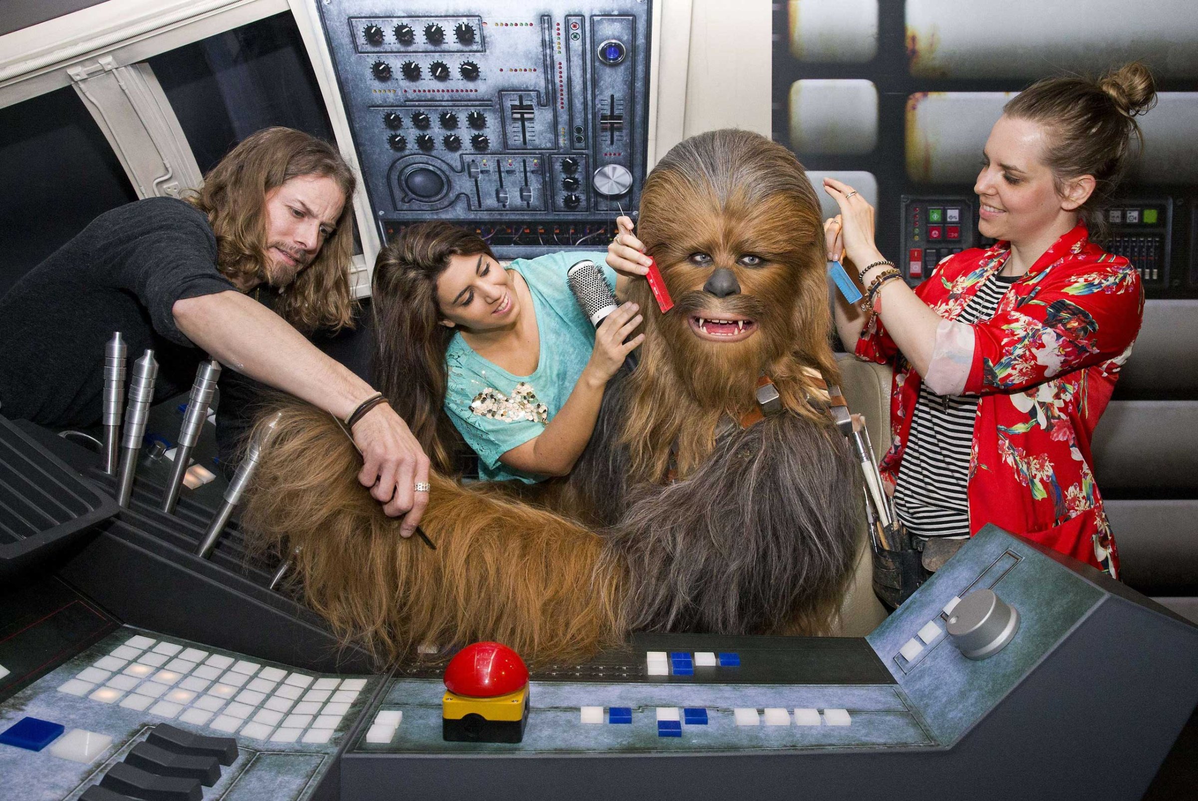 Members of staff put the finishing touches to the wax figure of Star Wars character Chewbacca at the Star Wars At Madame Tussauds attraction in London on May 12, 2015.