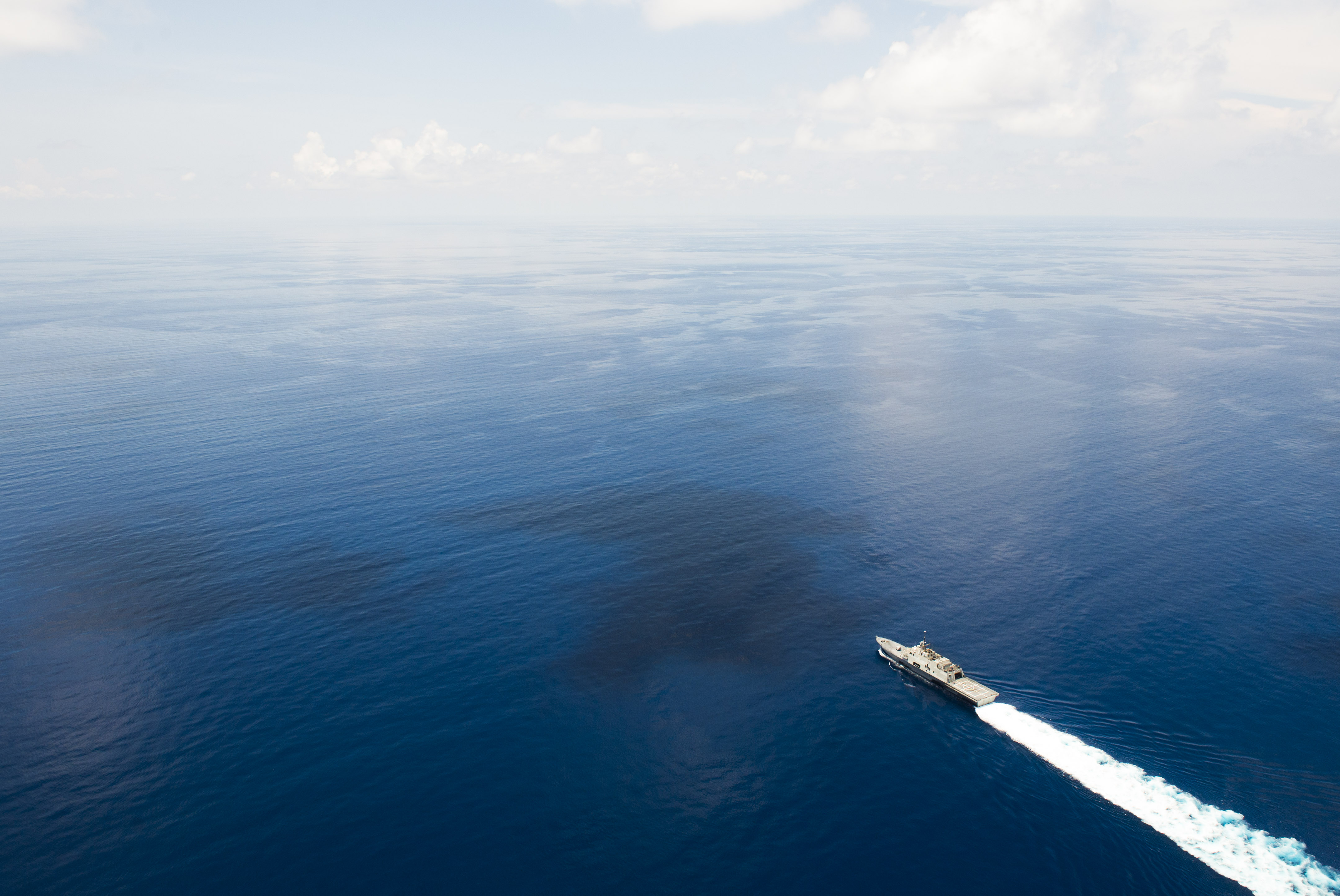 The littoral combat ship USS Fort Worth (LCS 3) sails near the Spratly Islands in the South China Sea last month. (Conor Minto / U.S. Navy)