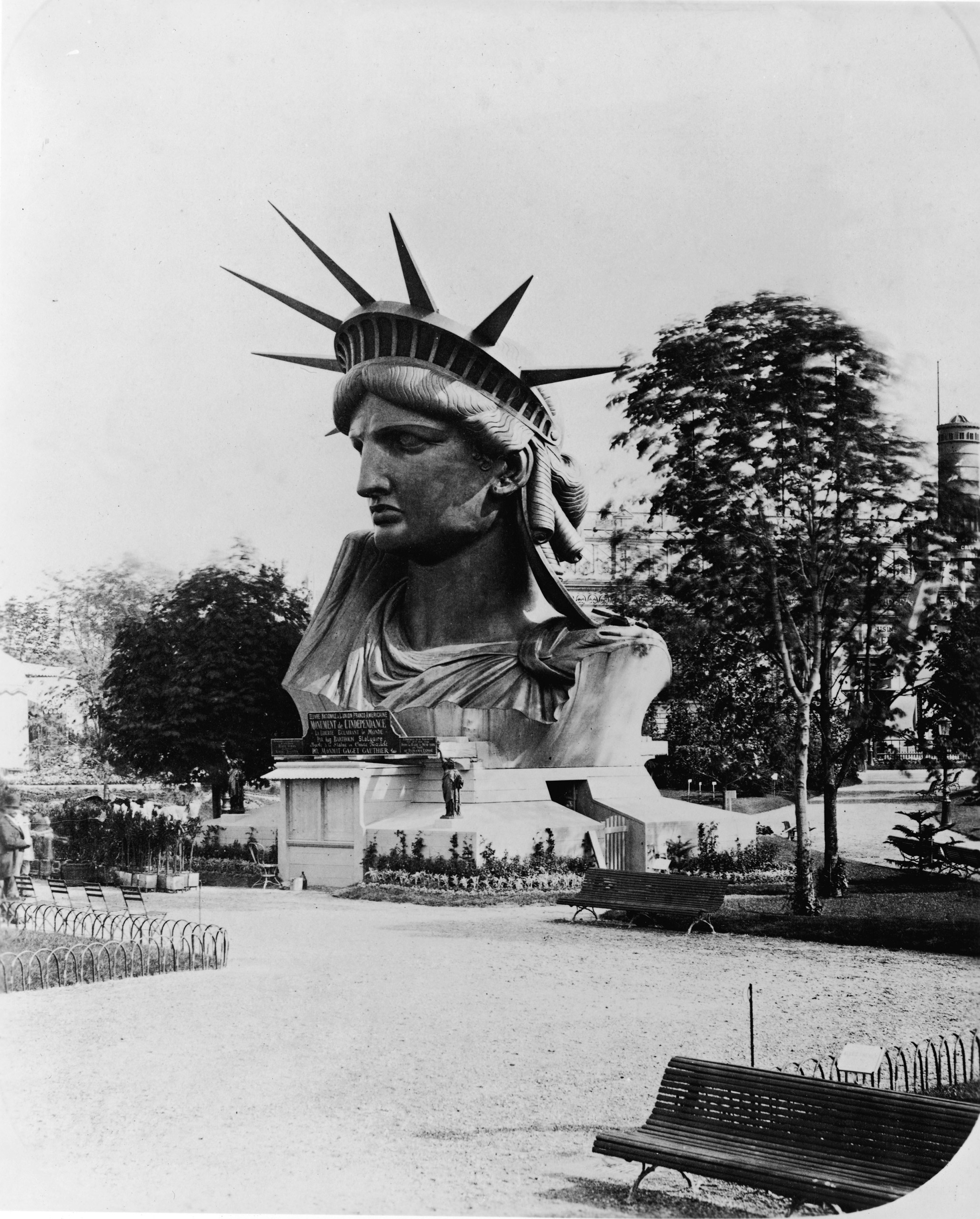The head of the Statue of Liberty on display in the garden at the Champ de Mars at the World's Fair in Paris to drum up support and contributions for the completion of the great project, 1878.