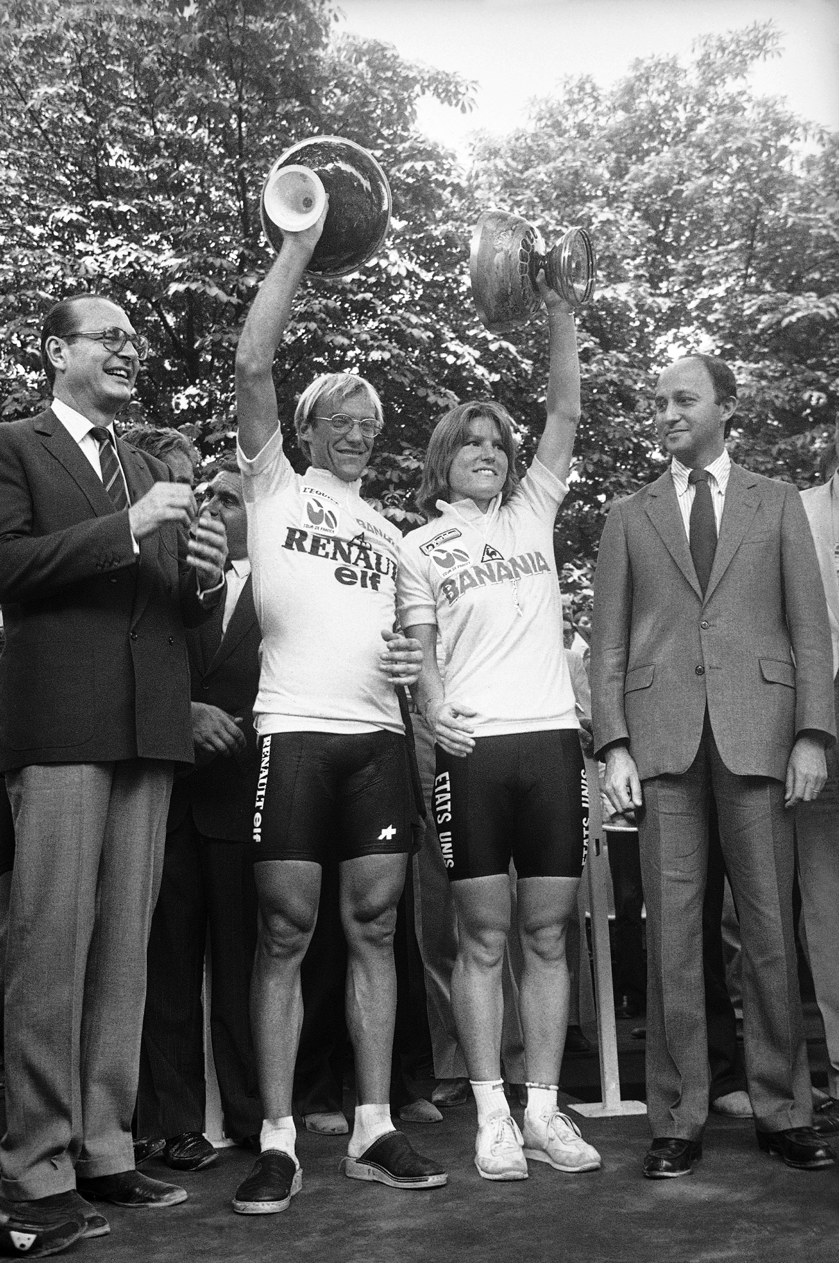 Laurent F. Fignon, left, of France, and Marianne Martin of Boulder, Colorado, hold up their trophies in Paris  Sunday, July 23, 1984 after winning the men’s and women’s Tour de France cycling races. This was the first year for the women’s event.