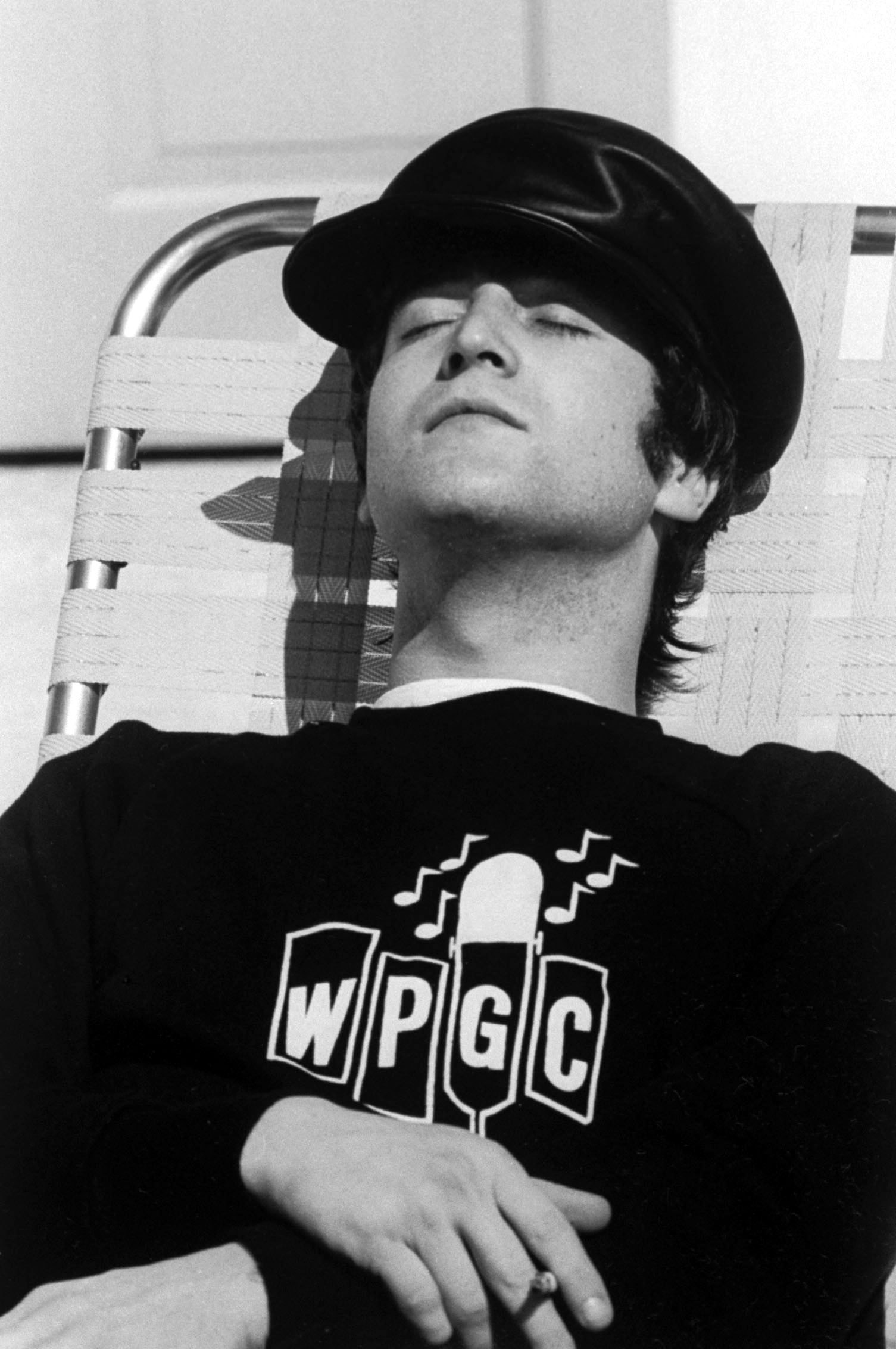 John Lennon poolside 1964