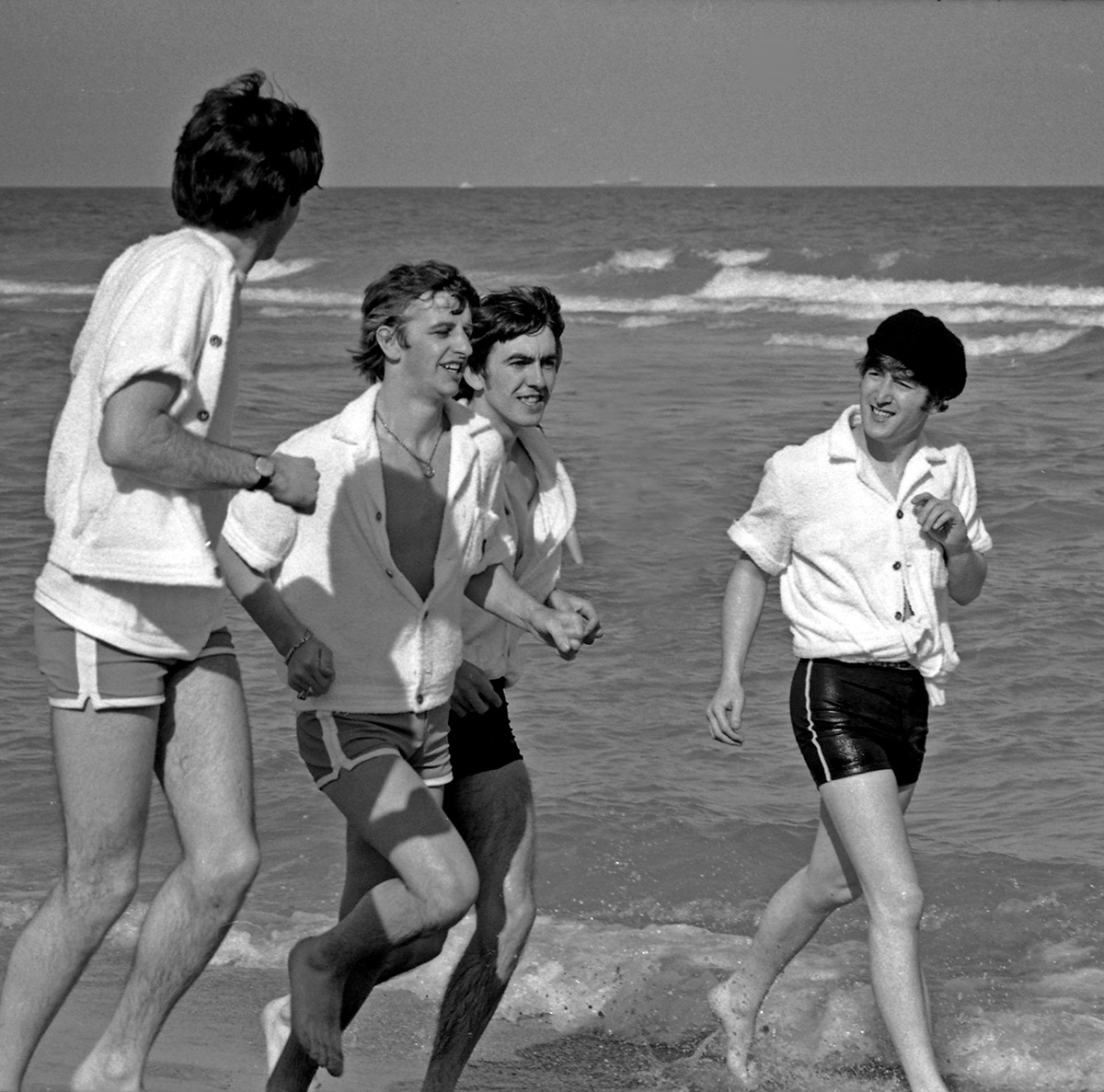 The Beatles running on the beach in Miami, Florida, February 1964.