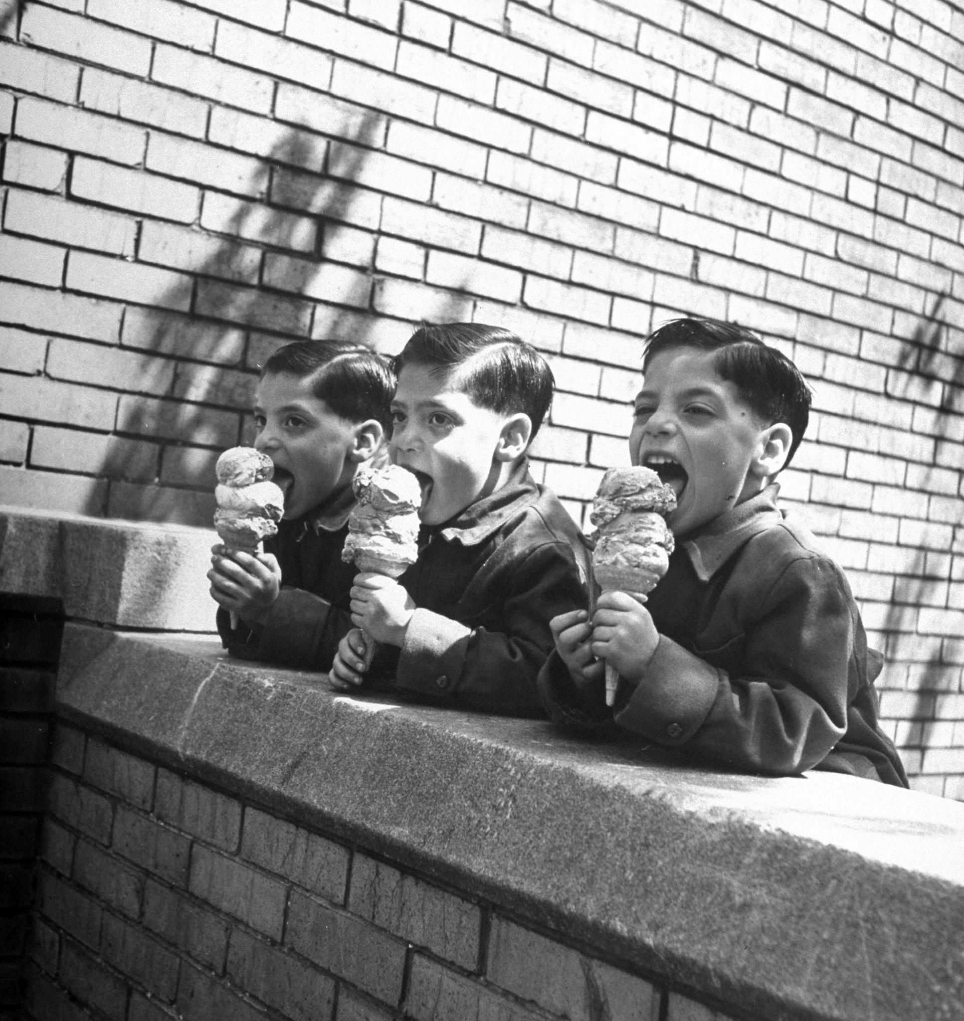 Triplets eating ice cream cones, Robert (L), Sheldon (C) and Ronald (R) Schwartz, 1949.