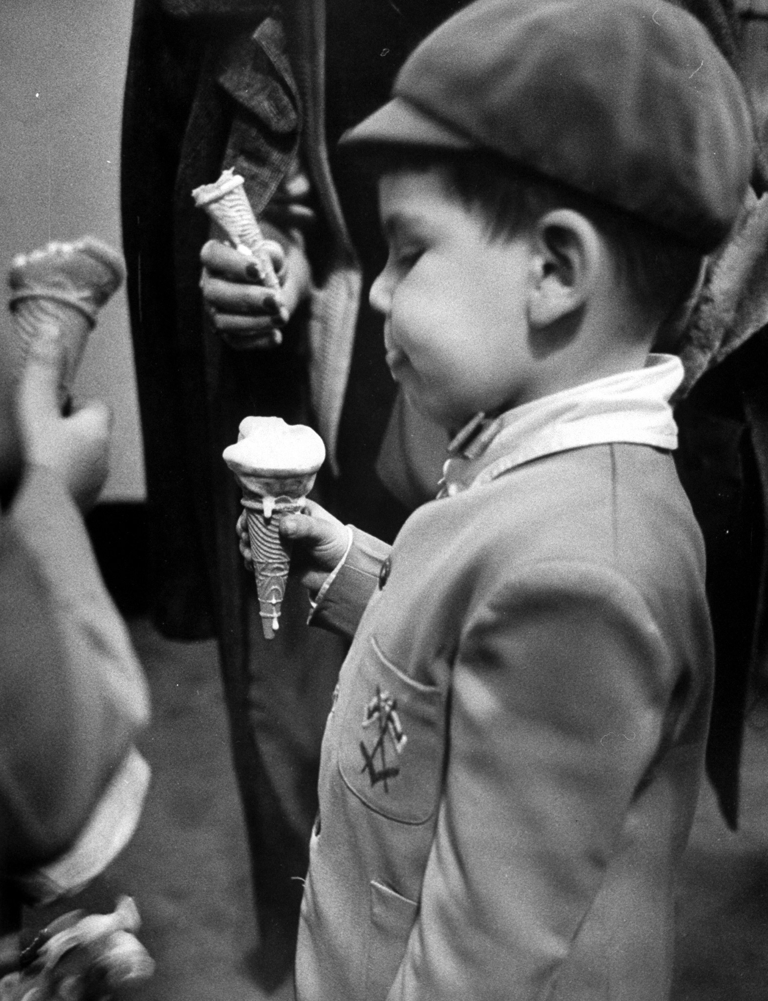 Boy eating ice cream cone at the circus in Madison Square Garden, 1953.