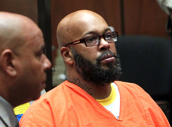Marion "Suge" Knight appears in court with his lawyer for a preliminary hearing at the Criminal Courts Building in Los Angeles on April 8, 2015. (David Buchan—Getty Images)