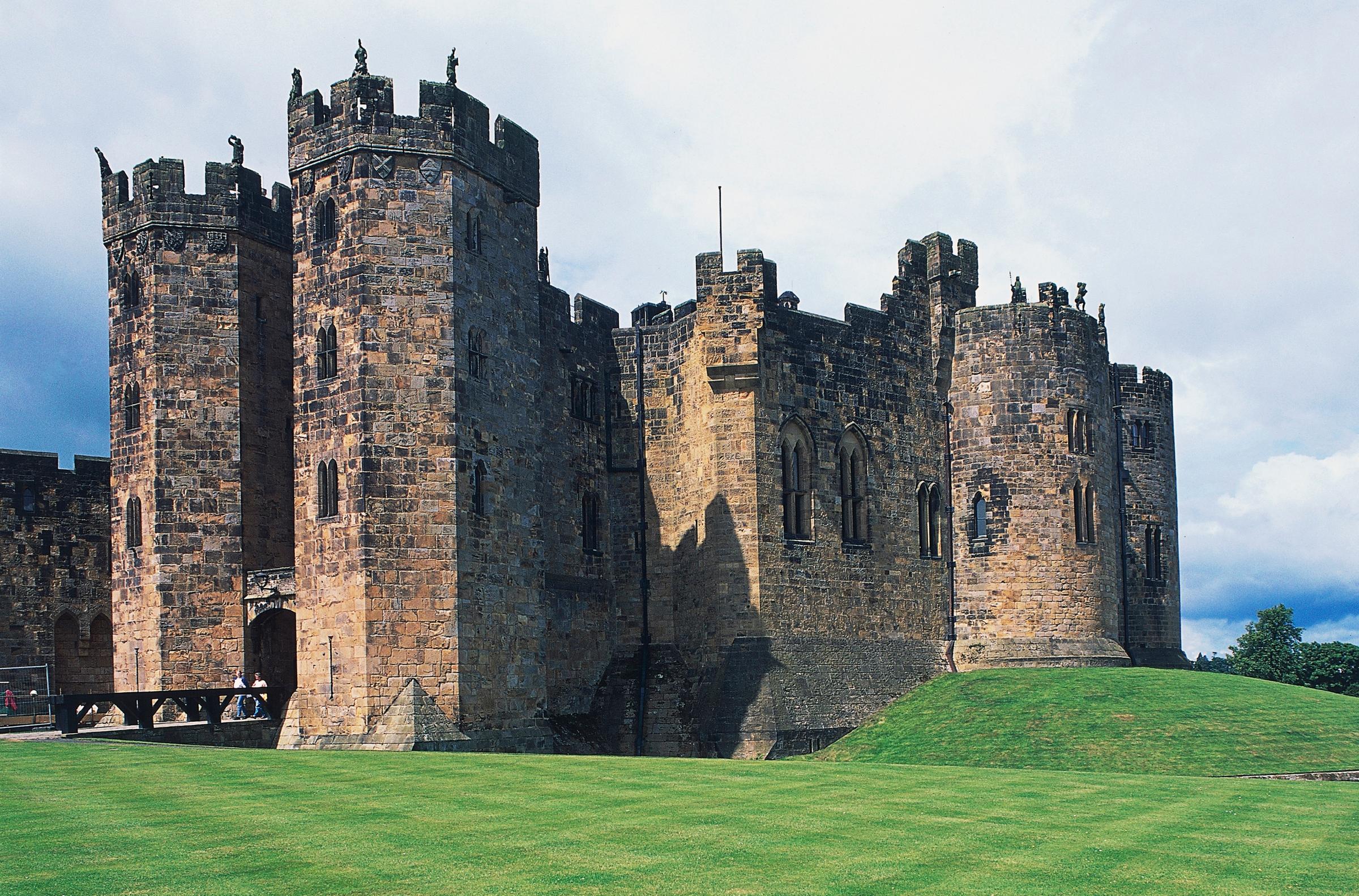Alnwick Castle in Northumberland, England. This Medieval castle was used as a set for the fictional Hogwarts School for Witchcraft and Wizardry in the first two Harry Potter films. You'll see Alnwick in familiar scenes like Harry's first broomstick flying lesson in 'Harry Potter and the Sorcerer's Stone' or Ron's flying car crash in 'Harry Potter and the Chamber of Secrets.'