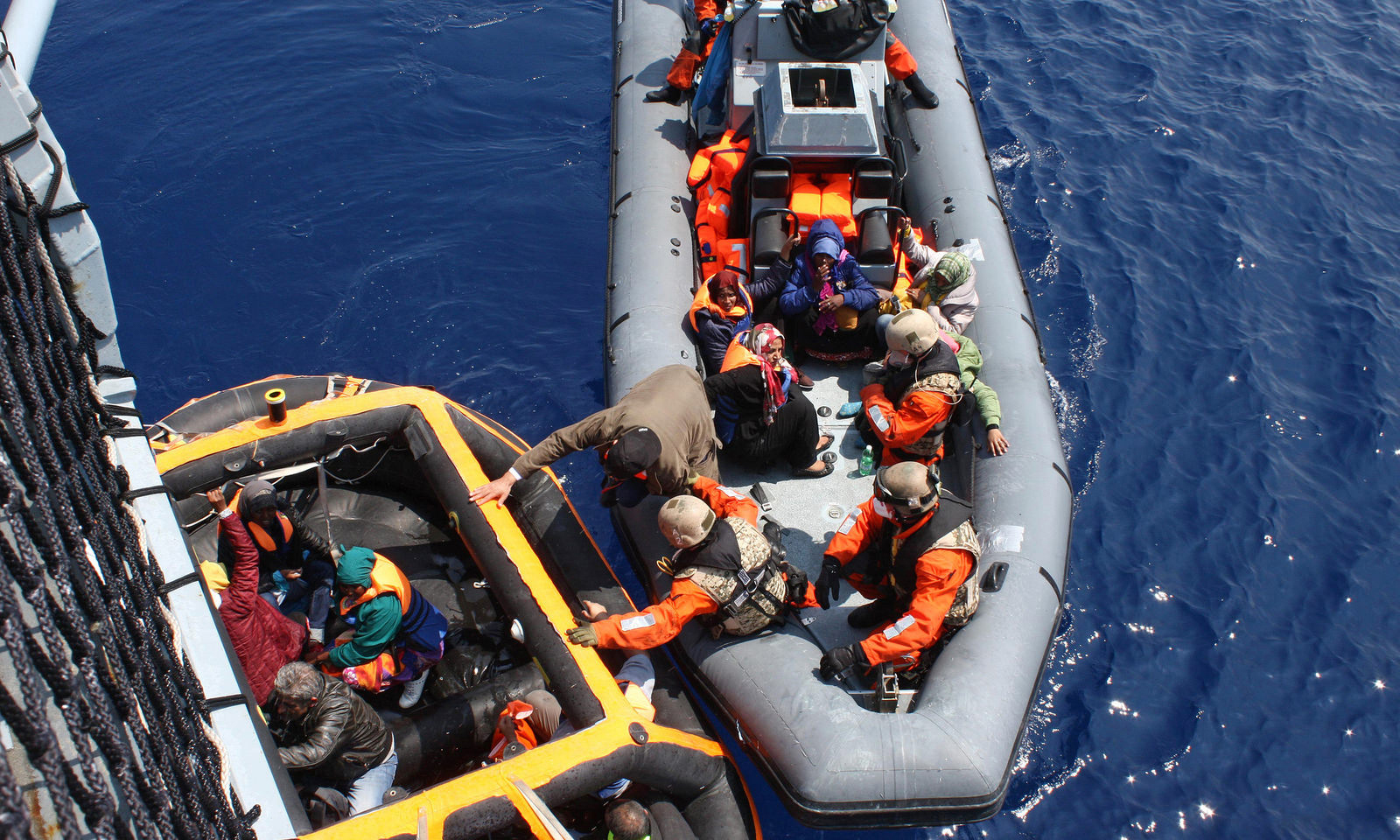 Soldiers of the German Navy ship Hessen rescue migrants in the Mediterranean Sea on June 6, 2015 (Sascha Jonack— Bundeswehr/AP)