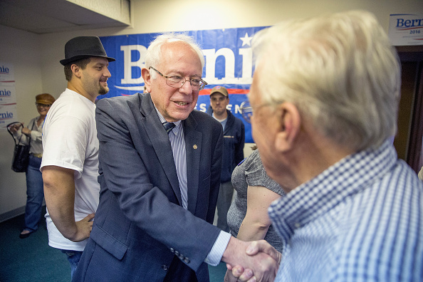 Democratic Presidential candidate and U.S. Sen. Bernie Sanders (I-VT) greets supporters during a visit to his Iowa campaign headquarters on June 13, 2015 in Des Moines, Iowa.