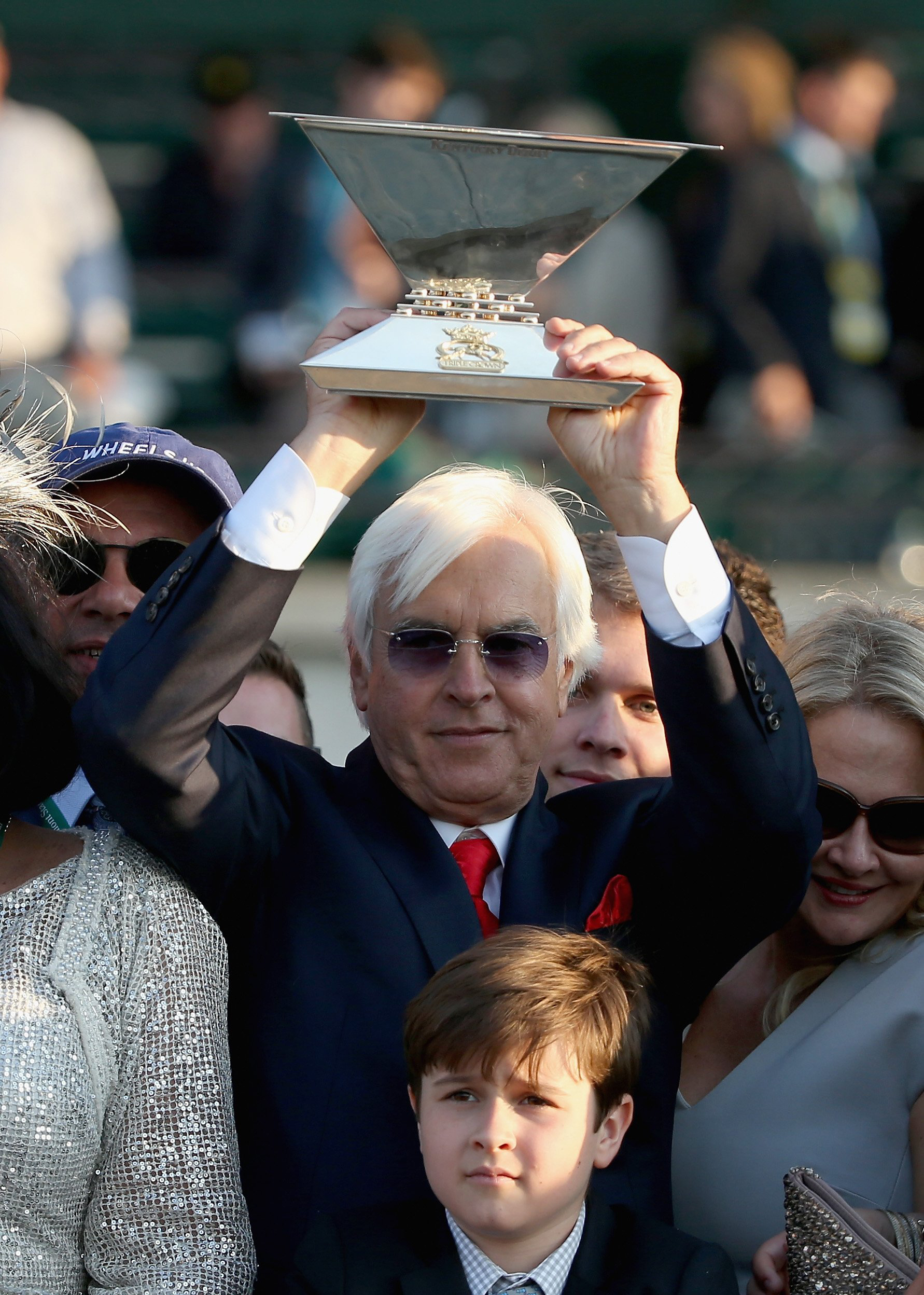 Trainer, Bob Baffert, of American Pharoah #5 celebrates with the Triple Crown Trophy after winning the 147th running of the Belmont Stakes at Belmont Park on June 6, 2015 in Elmont, N.Y. (Streeter Lecka—Getty Images)