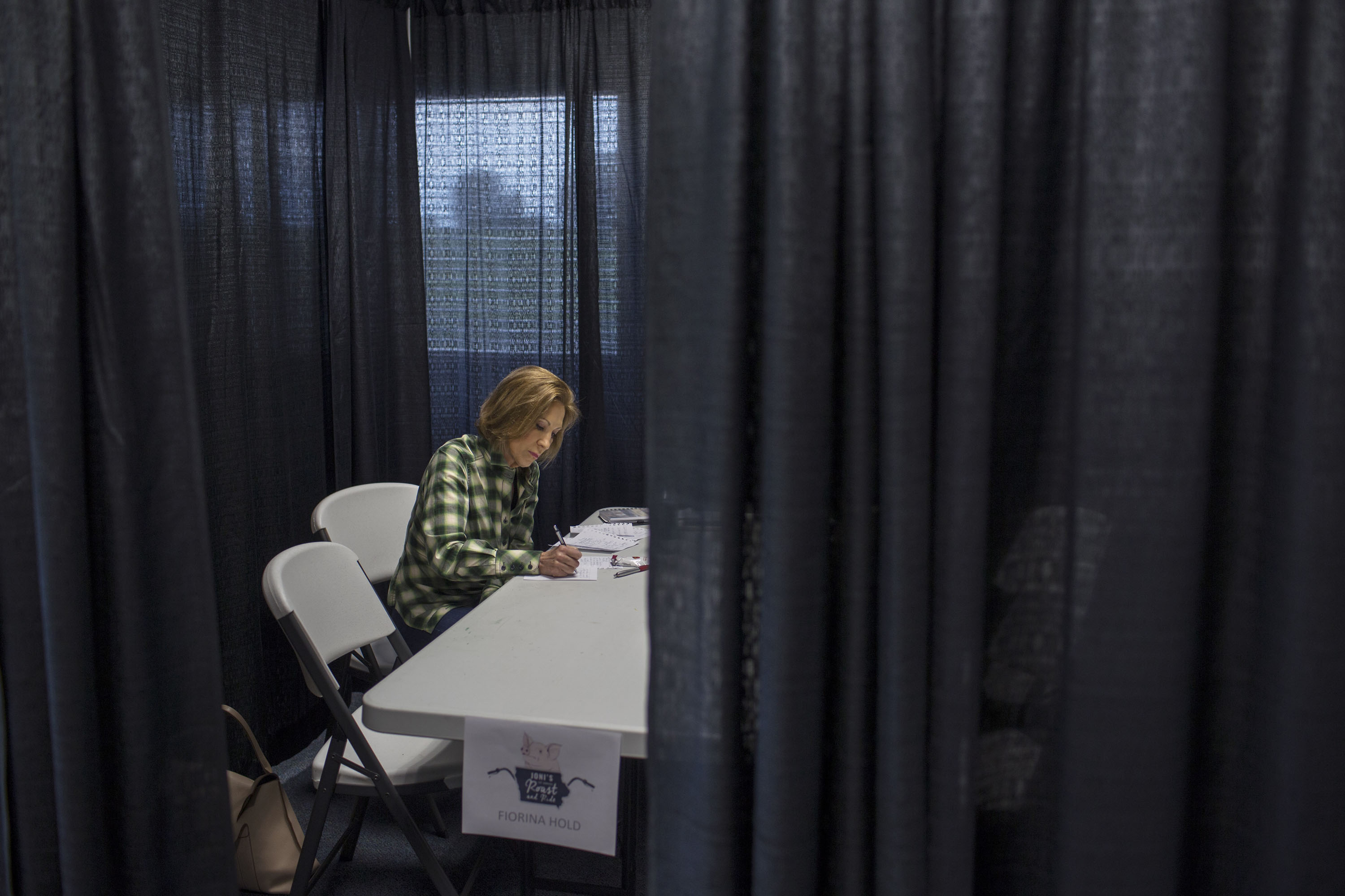 Fiorina works on her speech before the Roast and Ride, a campaign stop in Iowa on June 6. (Danny Wilcox Frazier—VII for TIME)