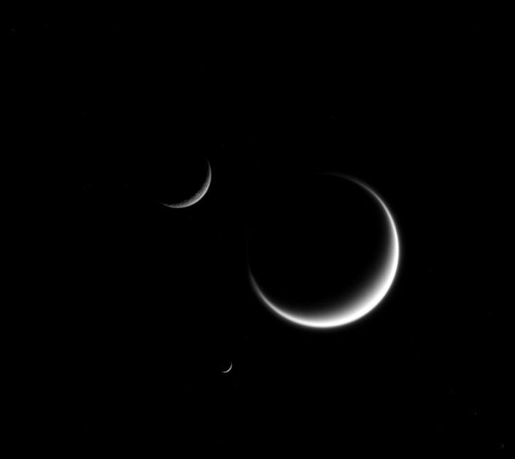 The moons Titan, Mimas, and Rhea, captured by Cassini in this image released on June 22, 2015. (NASA/JPL-Caltech/Space Science Institute)