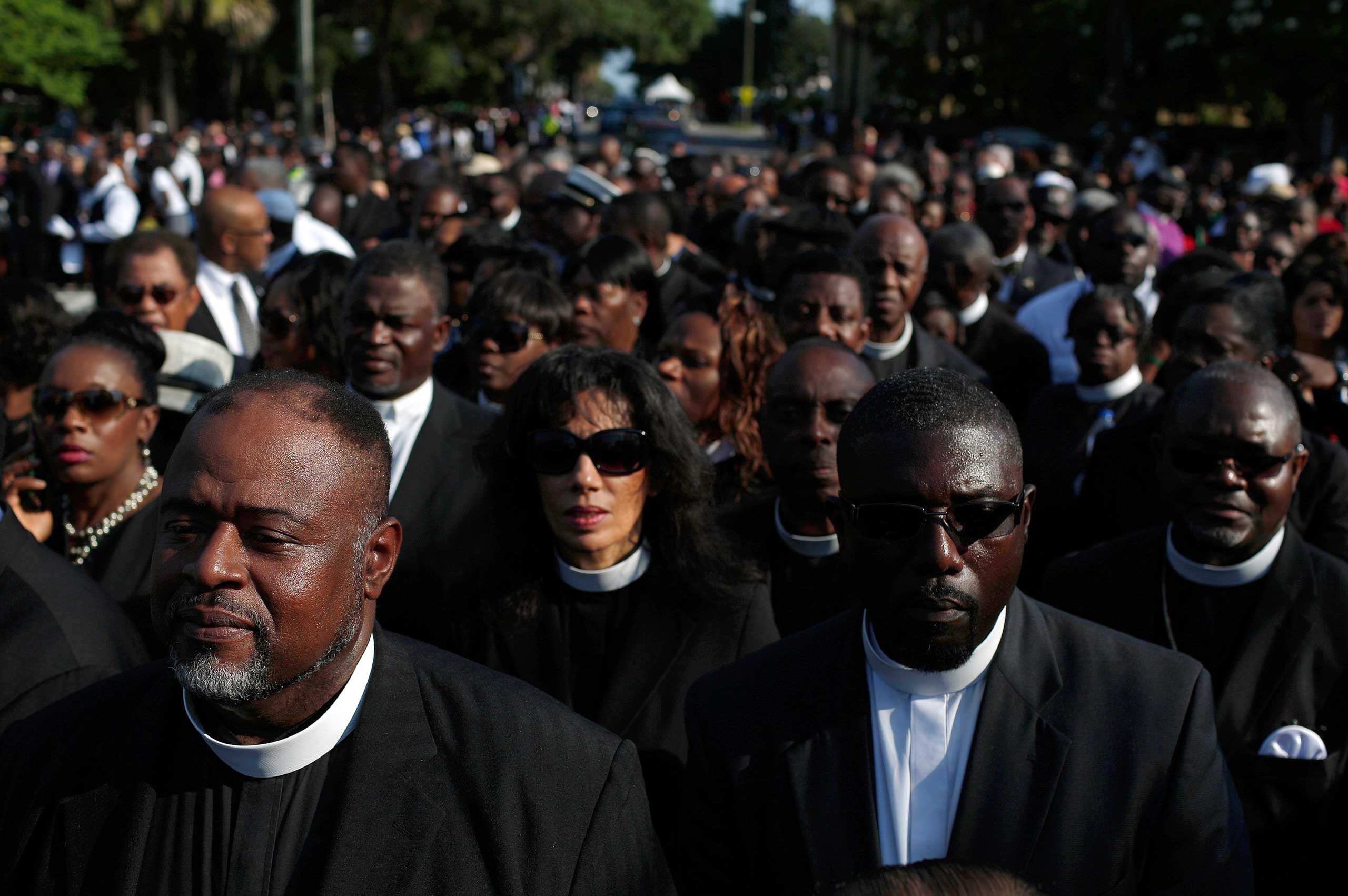Members of the clergy wait to enter the funeral service for Rev. Clementa Pinckney in Charleston, S.C. on June 26, 2015.