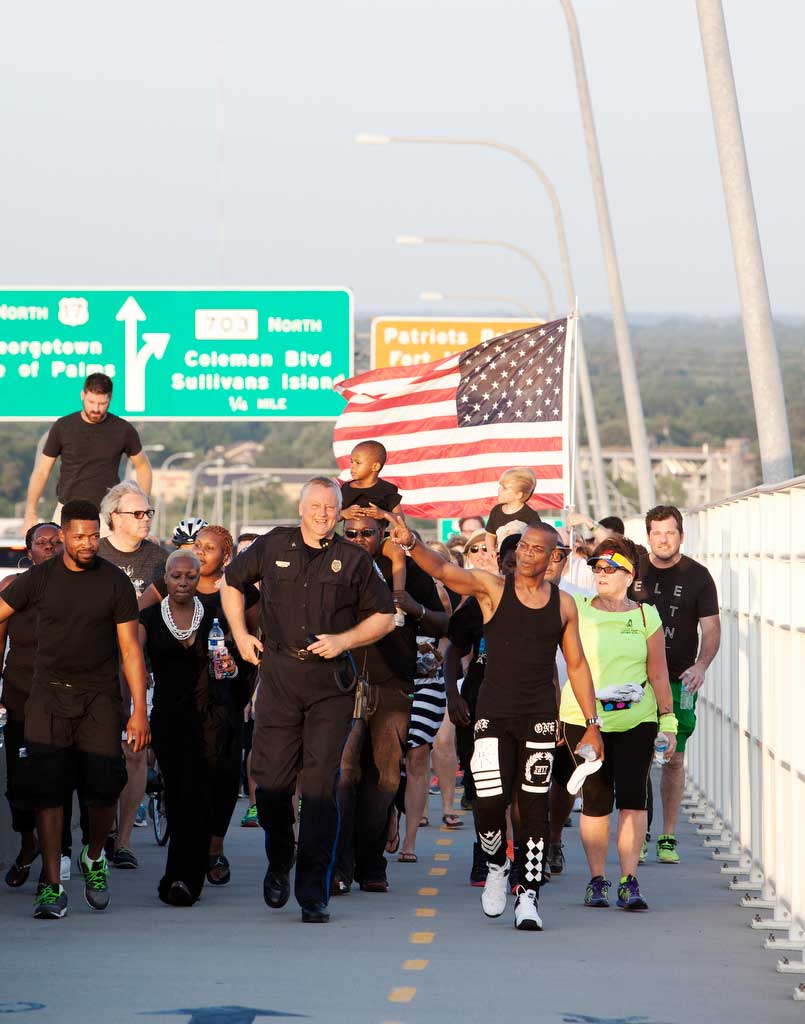 Mt. Pleasant Police Chief Carl Ritchie and Jay Johnson of Black Lives Matter lead marchers up the Mt. Pleasant side of the Arthur Ravenel, Jr. Bridge in Charleston, S.C. on June 21, 2015.