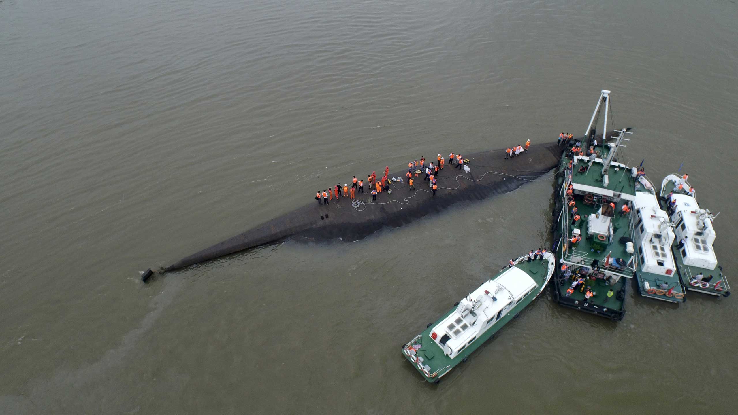 An aerial view shows rescue workers searching on the sunken ship at Jianli section of Yangtze River, Hubei province, China on June 2, 2015.