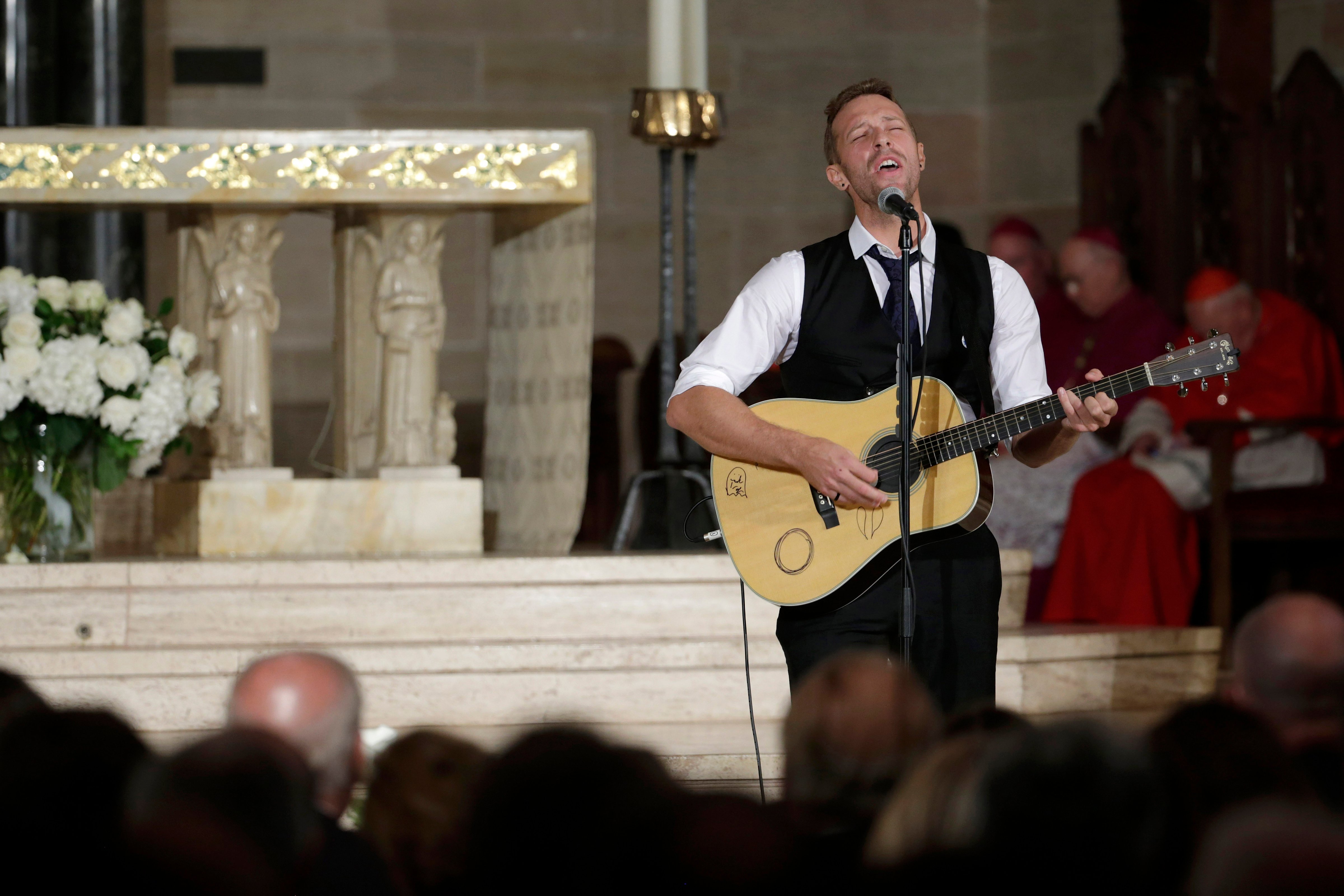 Chris Martin on the group Coldplay performs "Til Kingdom Comes" during funeral services for Vice President Joe Biden's son, former Delaware Attorney General Beau Biden, at St. Anthony of Padua Church in Wilmington, Del., on June 6, 2015. (Pablo Martinez Monsivais—AP)