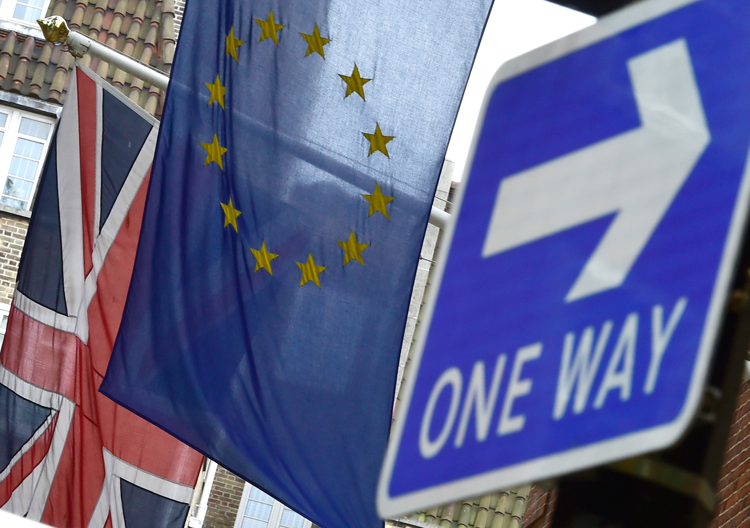The British Union flag and European Union flag are seen hanging outside Europe House in central London on June 9, 2015. (Toby Melville —Reuters)