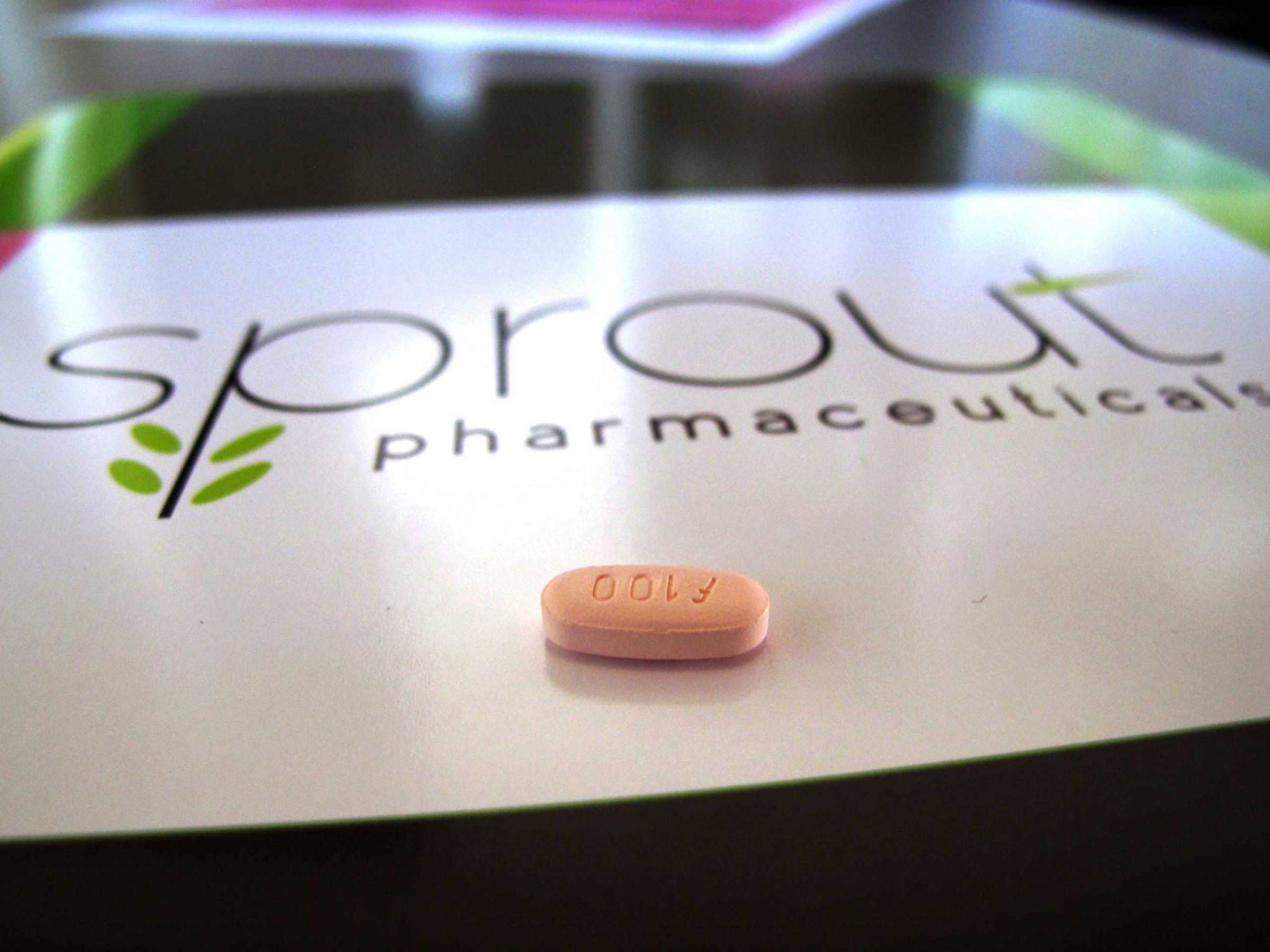 A tablet of flibanserin sits on a brochure for Sprout Pharmaceuticals in the company's Raleigh, N.C., headquarters.