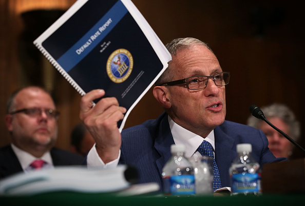 Fred Hochberg, Chairman and President of the Export-Import Bank of the United States holds up a copy of the bank's Default Rate Report as he testifies during a hearing before the Senate Banking, Housing and Urban Affairs Committee June 4, 2015 on Capitol Hill in Washington, D.C. (Alex Wong—Getty Images)