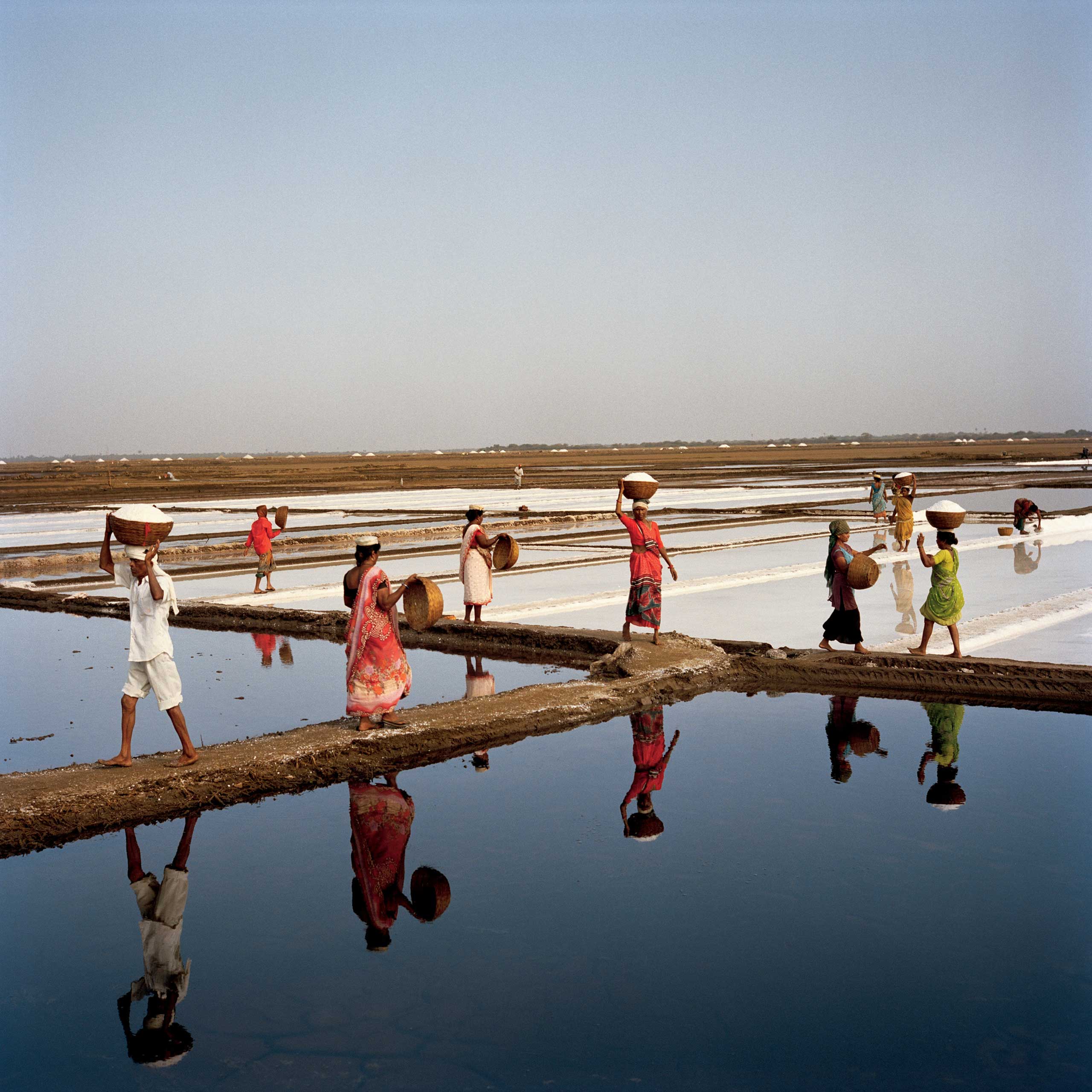 From the July issue of National Geographic magazine:  In the Footsteps of Gandhi
                              Workers harvest salt in Dharasana, Gujarat. In May 1930, the month after Gandhi led a march to protest British restrictions on salt, activists trained in nonviolent resistance marched here and were savagely beaten, a seminal event that advanced India’s drive for independence.