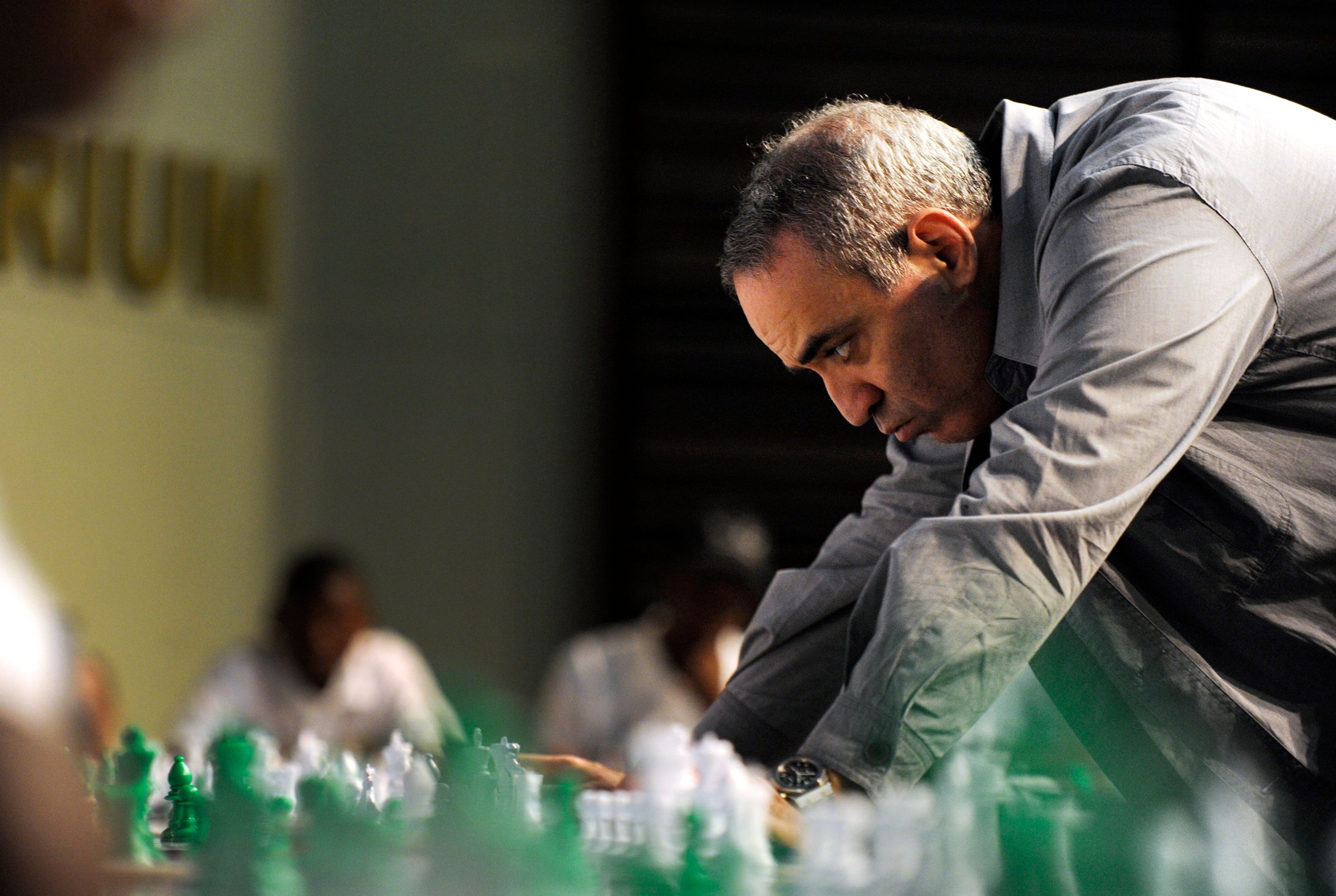 Former World Chess Champion Garry Kasparov plays a game of chess with school children on March 25, 2012 in Pretoria, South Africa.