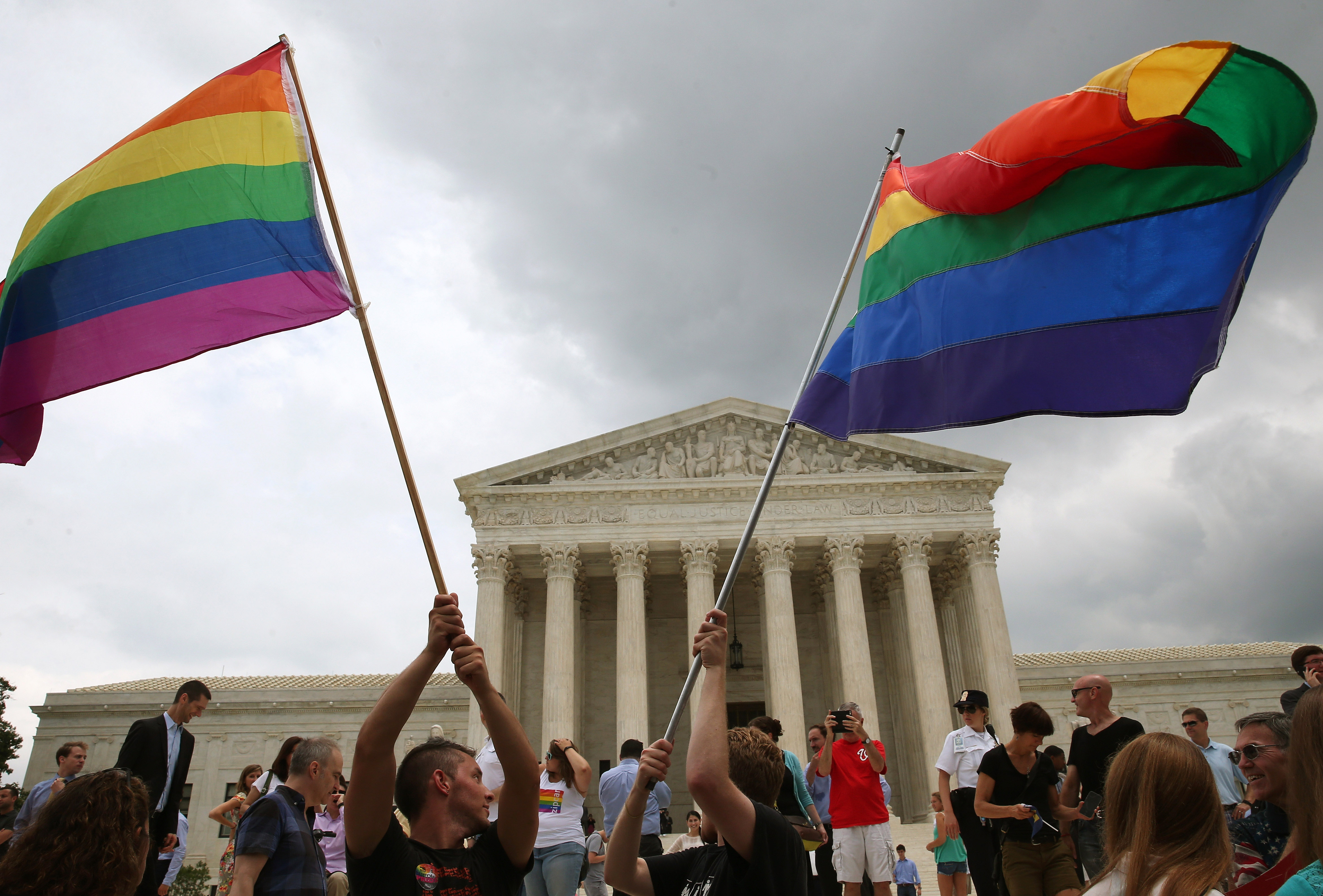 People celebrate in front of the U.S. Supreme Court after the ruling in favor of same-sex marriage June 26, 2015 in Washington, DC.