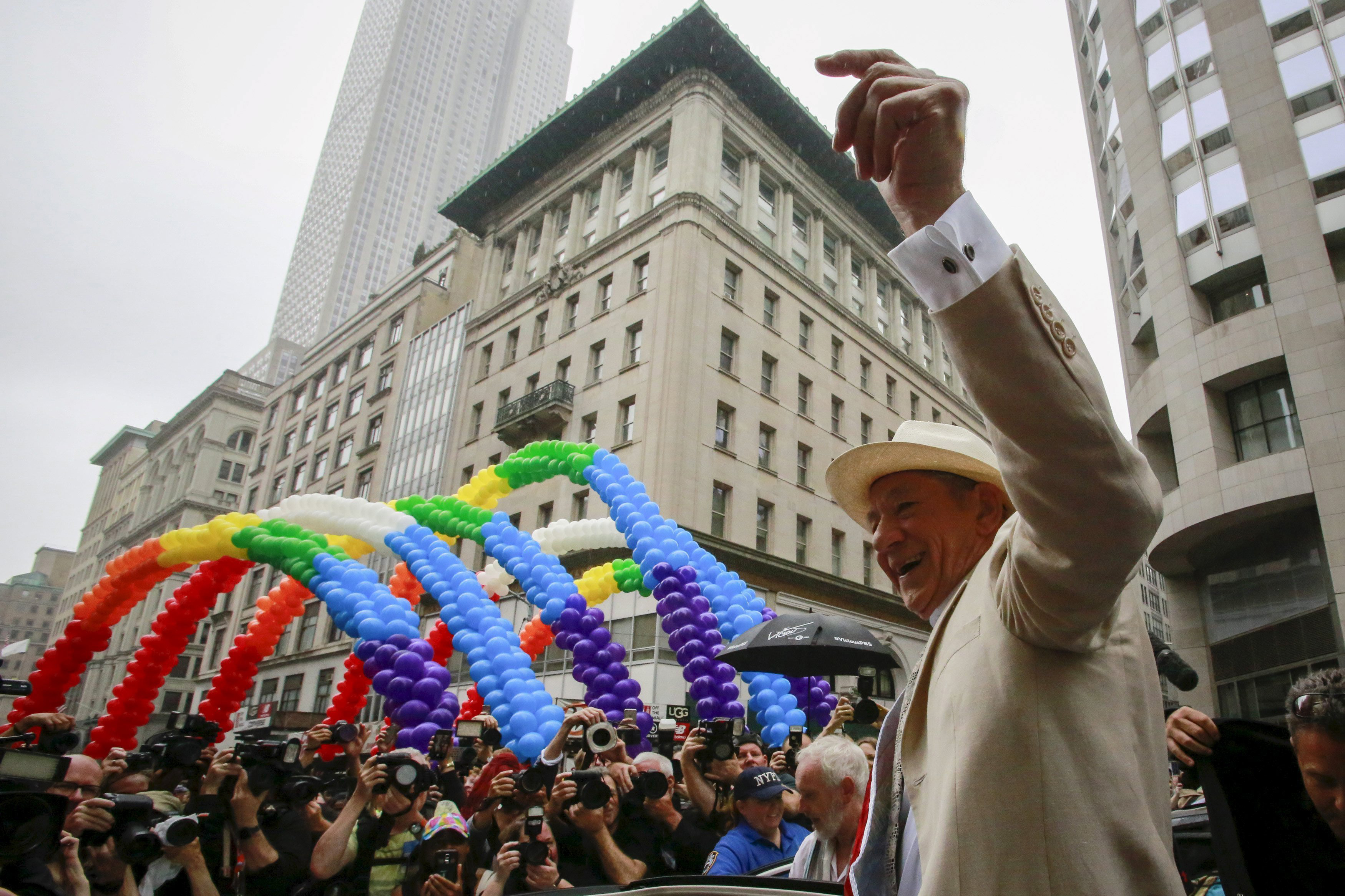 Actor Ian McKellen waves to the crowd as he attends as grand marshal during the annual Gay Pride parade in New York City on June 28, 2015.