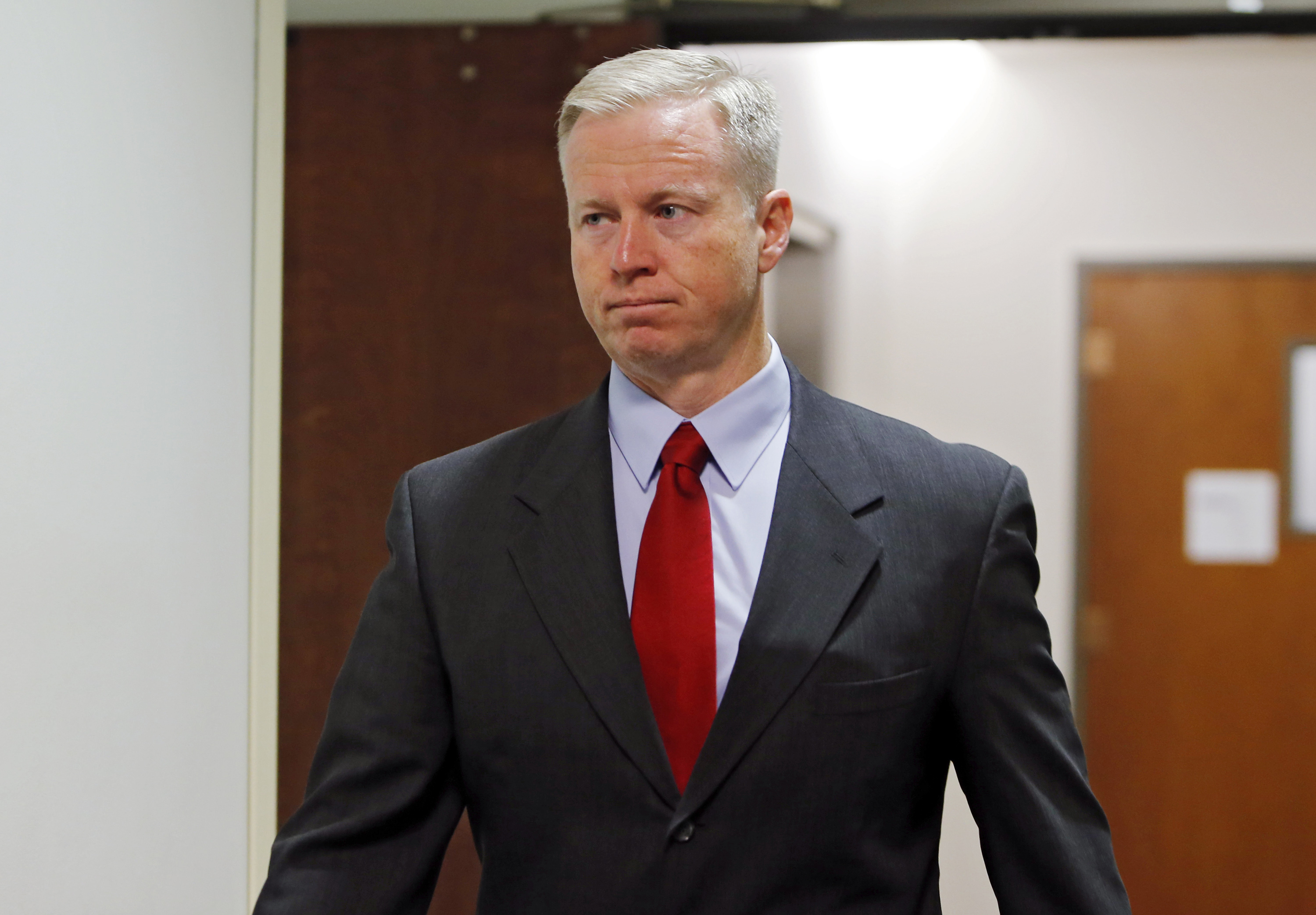 18th Judicial District Attorney George Brauchler arrives for a hearing for Aurora theater shooting suspect James Holmes at district court in Centennial, Colo. on Sept. 30, 2013. (Ed Andrieski—AP)